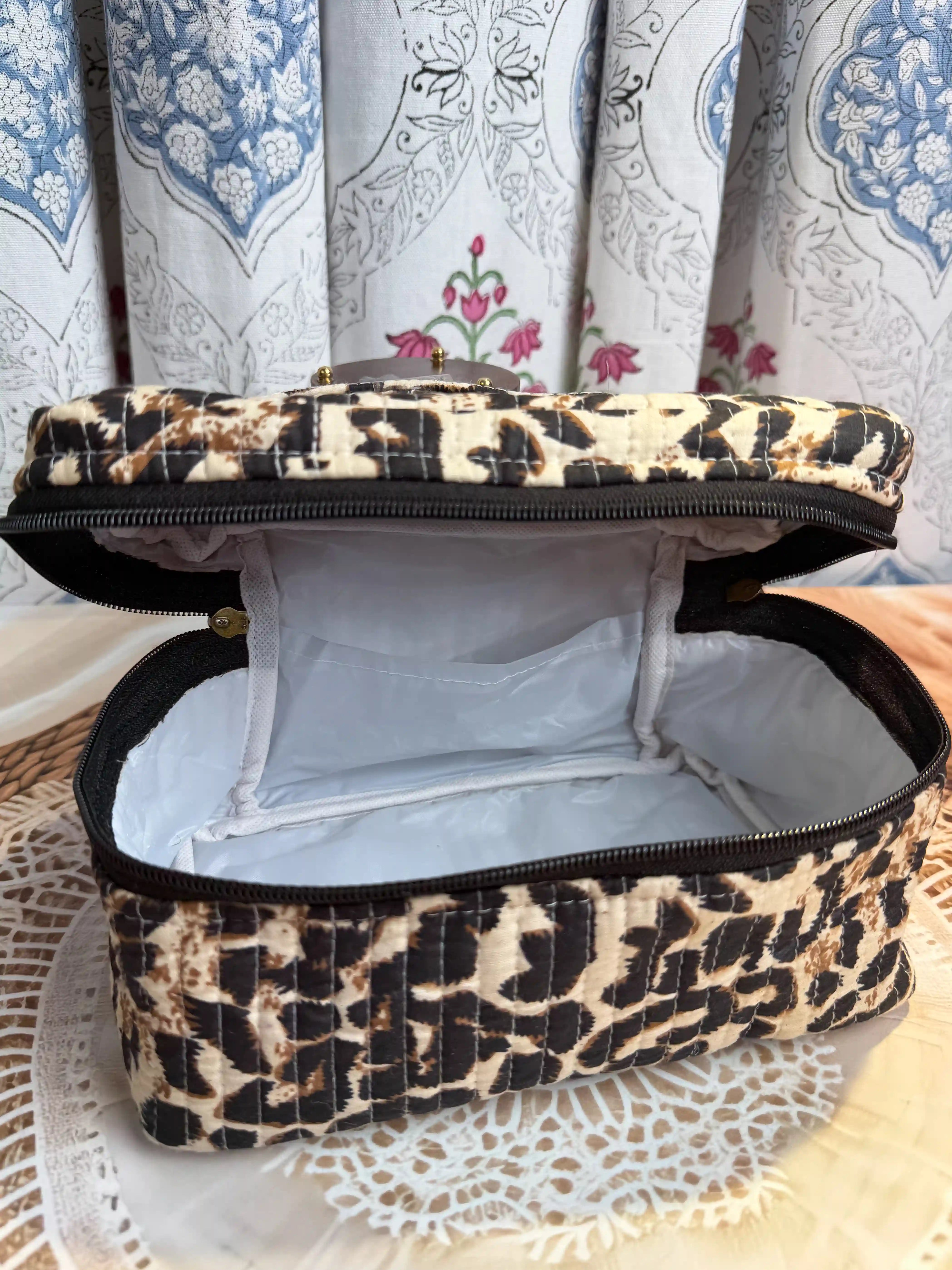 Beige quilted cotton cosmetic vanity bag with leopard print hand block pattern, animal print makeup organizer for travel and daily use
