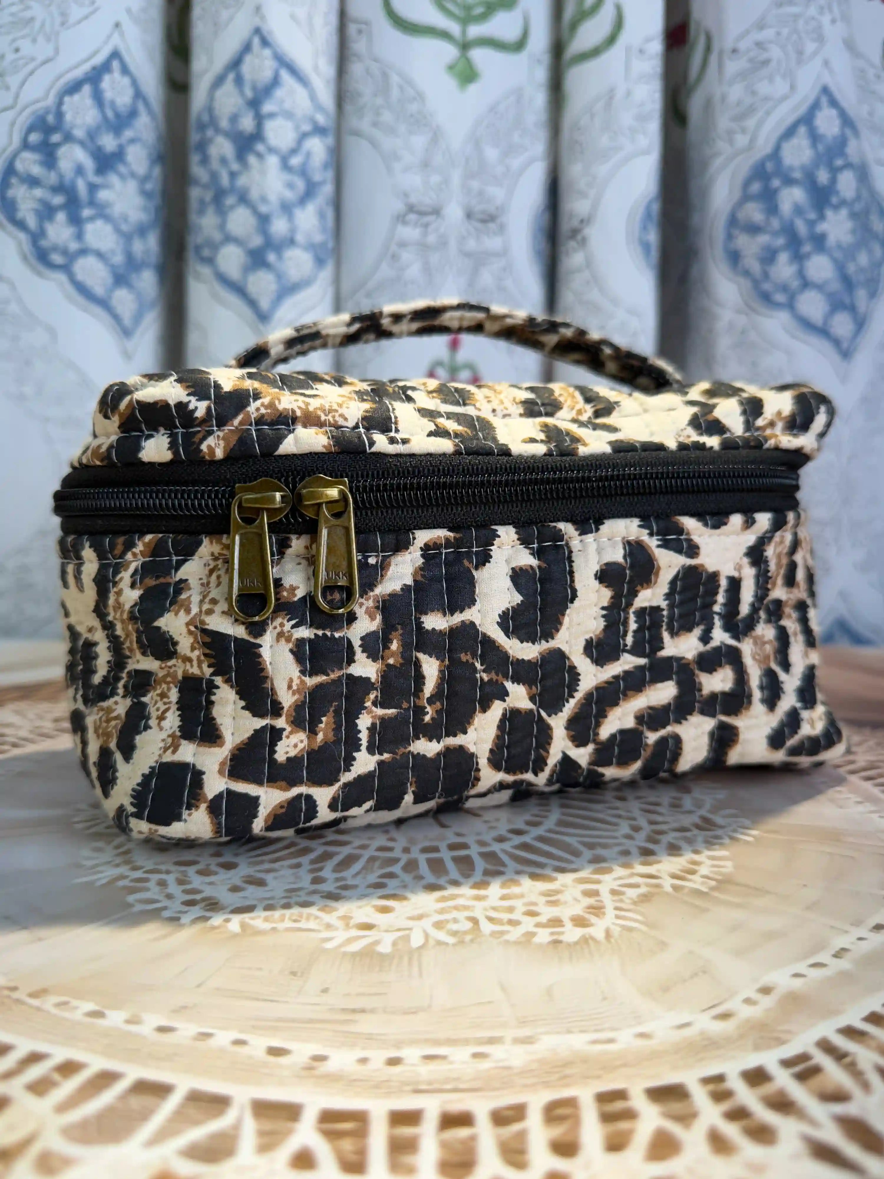 Beige quilted cotton cosmetic vanity bag with leopard print hand block pattern, animal print makeup organizer for travel and daily use