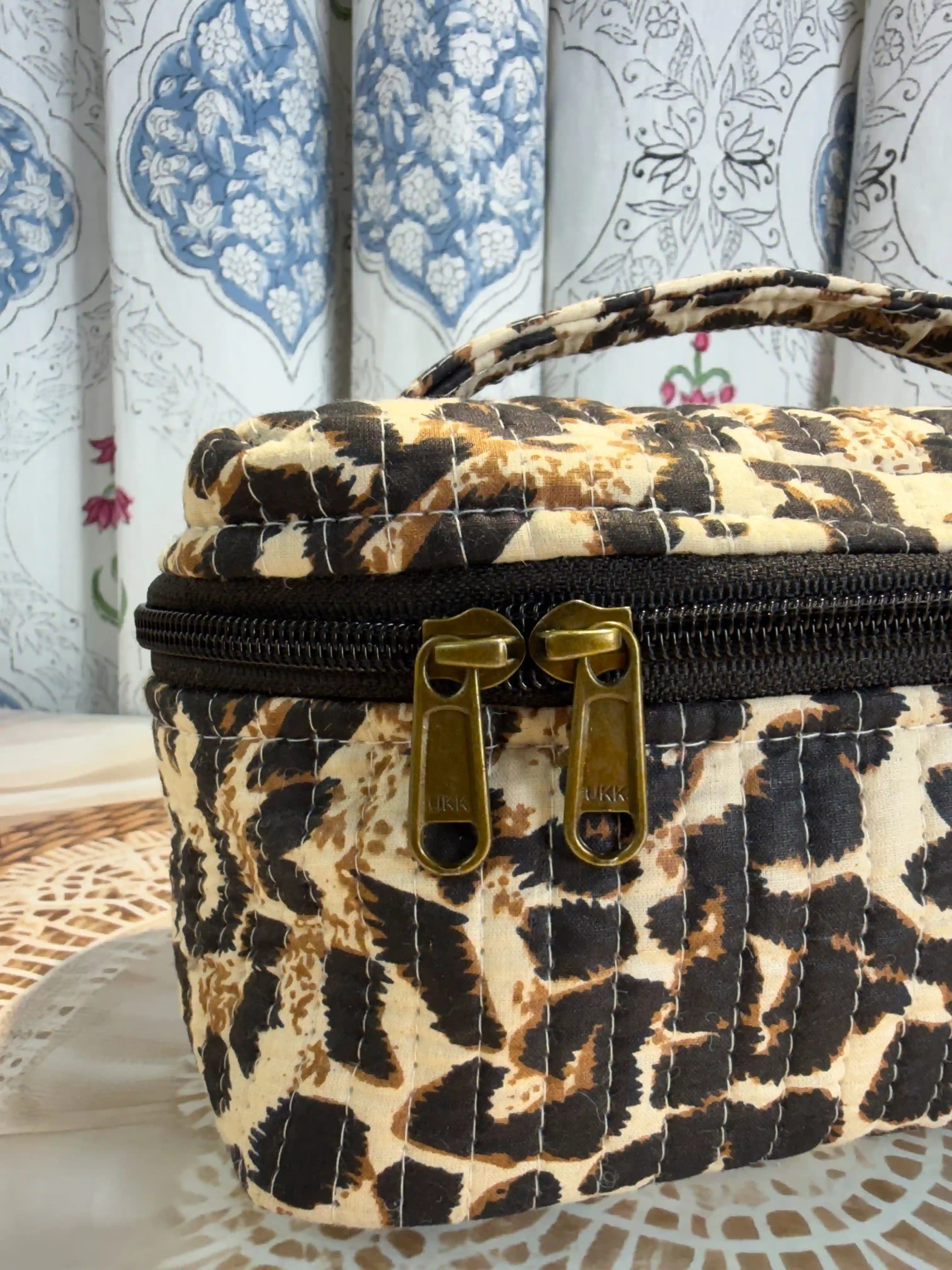 Beige quilted cotton cosmetic vanity bag with leopard print hand block pattern, animal print makeup organizer for travel and daily use