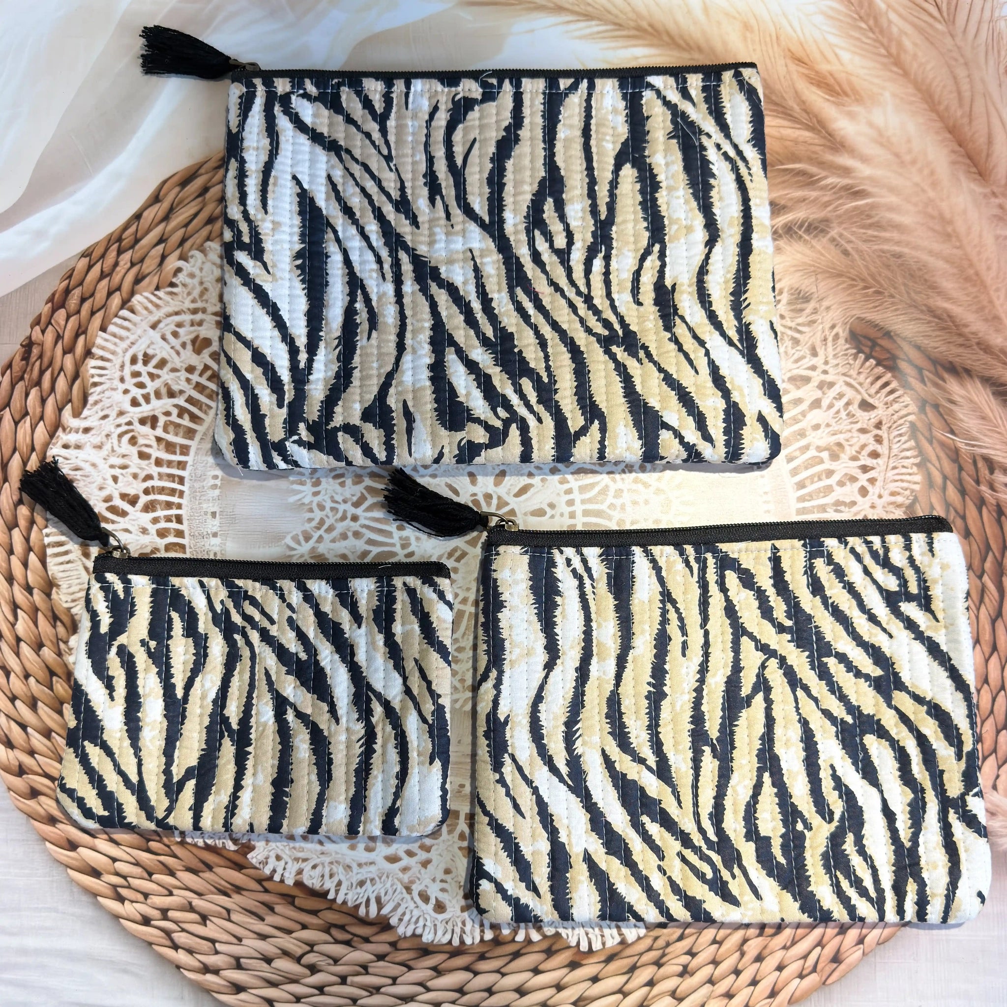 Black and white animal stripe quilted cotton flat pouch set with hand block pattern, animal print three-piece zipper pouches for makeup and travel storage.