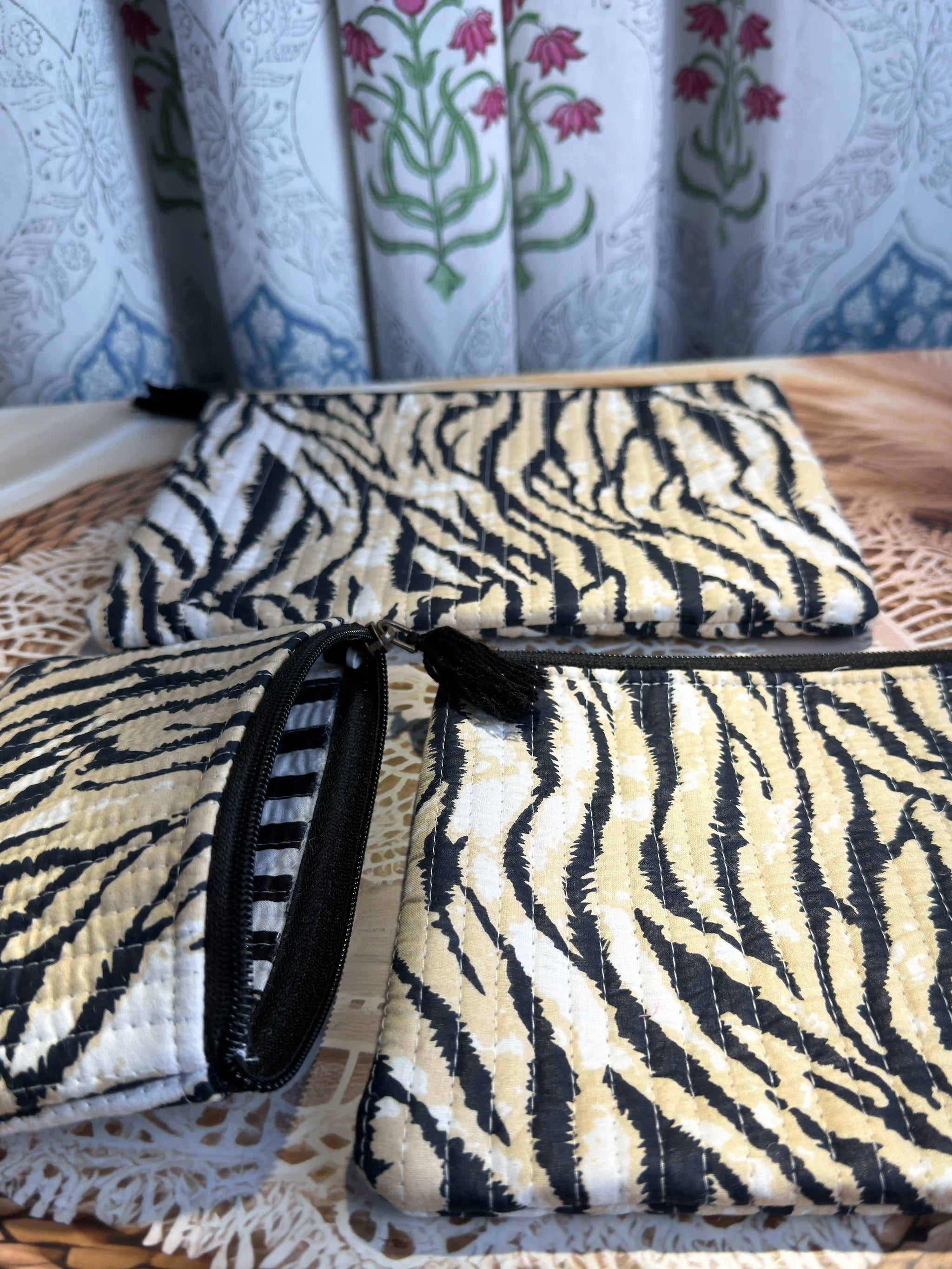 Black and white animal stripe quilted cotton flat pouch set with hand block pattern, animal print three-piece zipper pouches for makeup and travel storage.