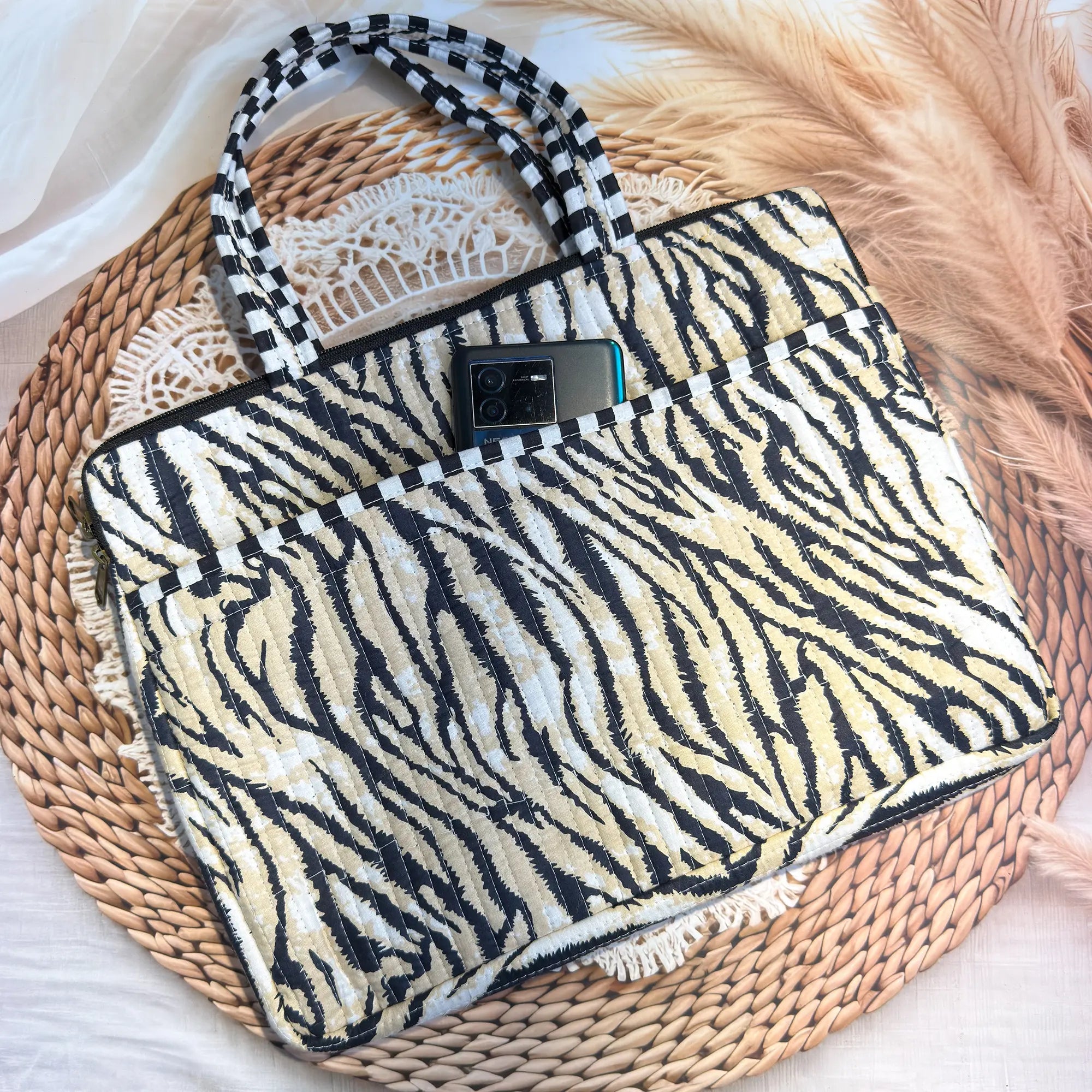 Black and cream quilted cotton laptop bag with zebra stripe hand block design, animal print padded laptop sleeve for everyday work use