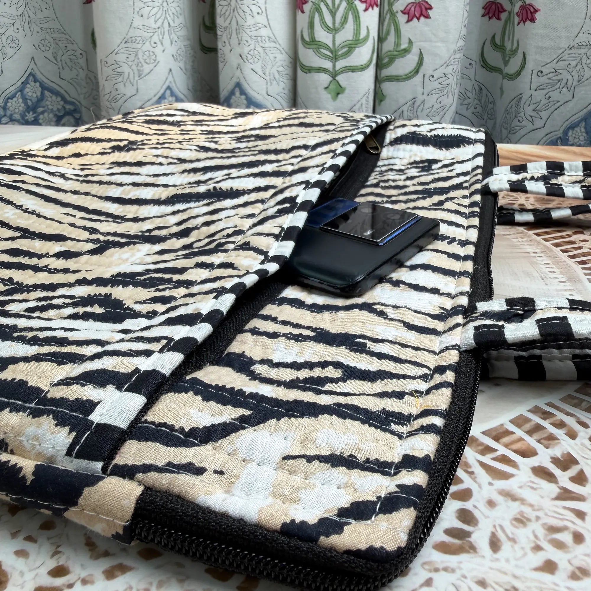 Black and cream quilted cotton laptop bag with zebra stripe hand block design, animal print padded laptop sleeve for everyday work use