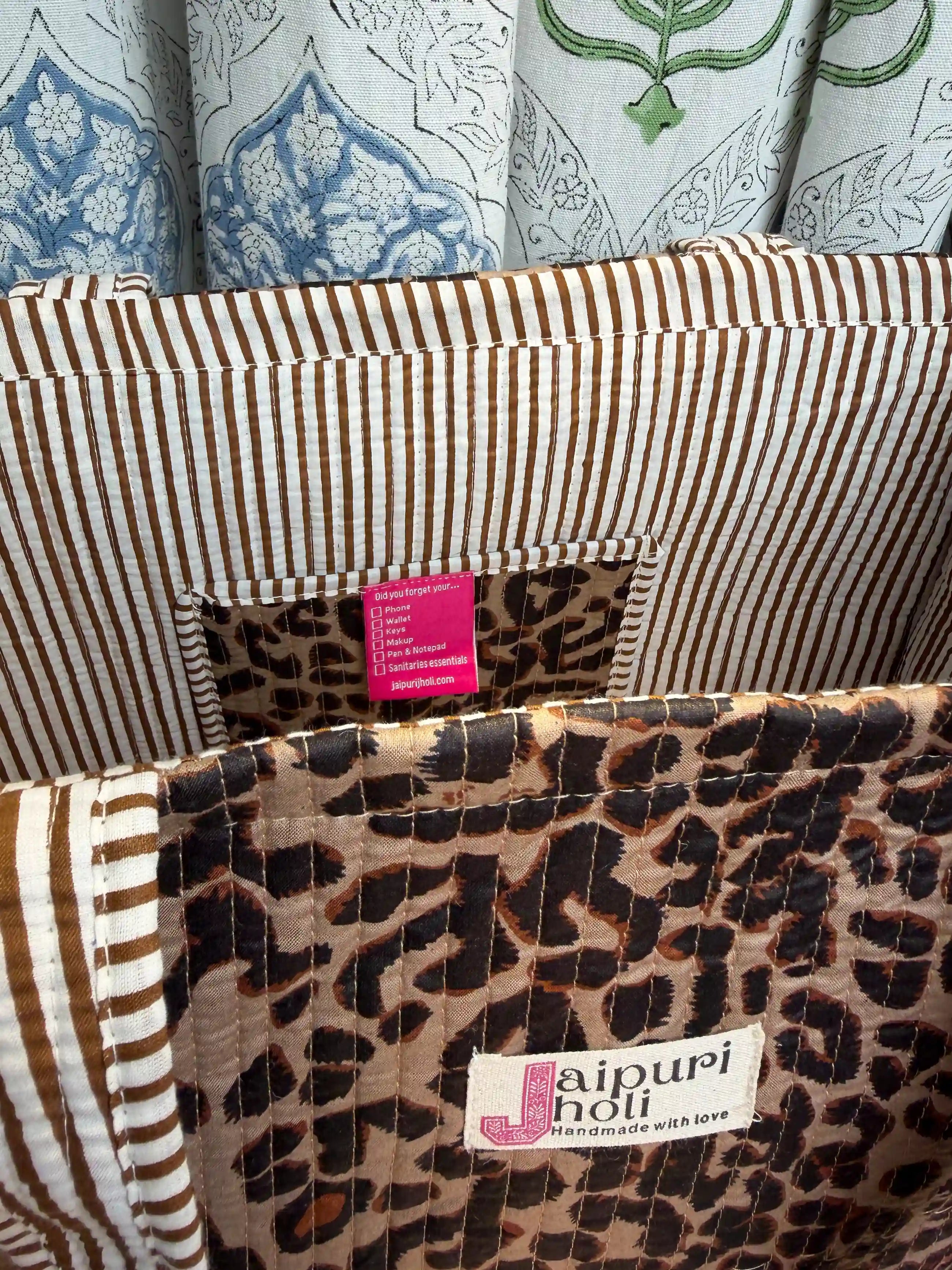 Black and brown quilted cotton open mini tote with leopard hand block pattern, lightweight animal print mini bag for daily essentials.