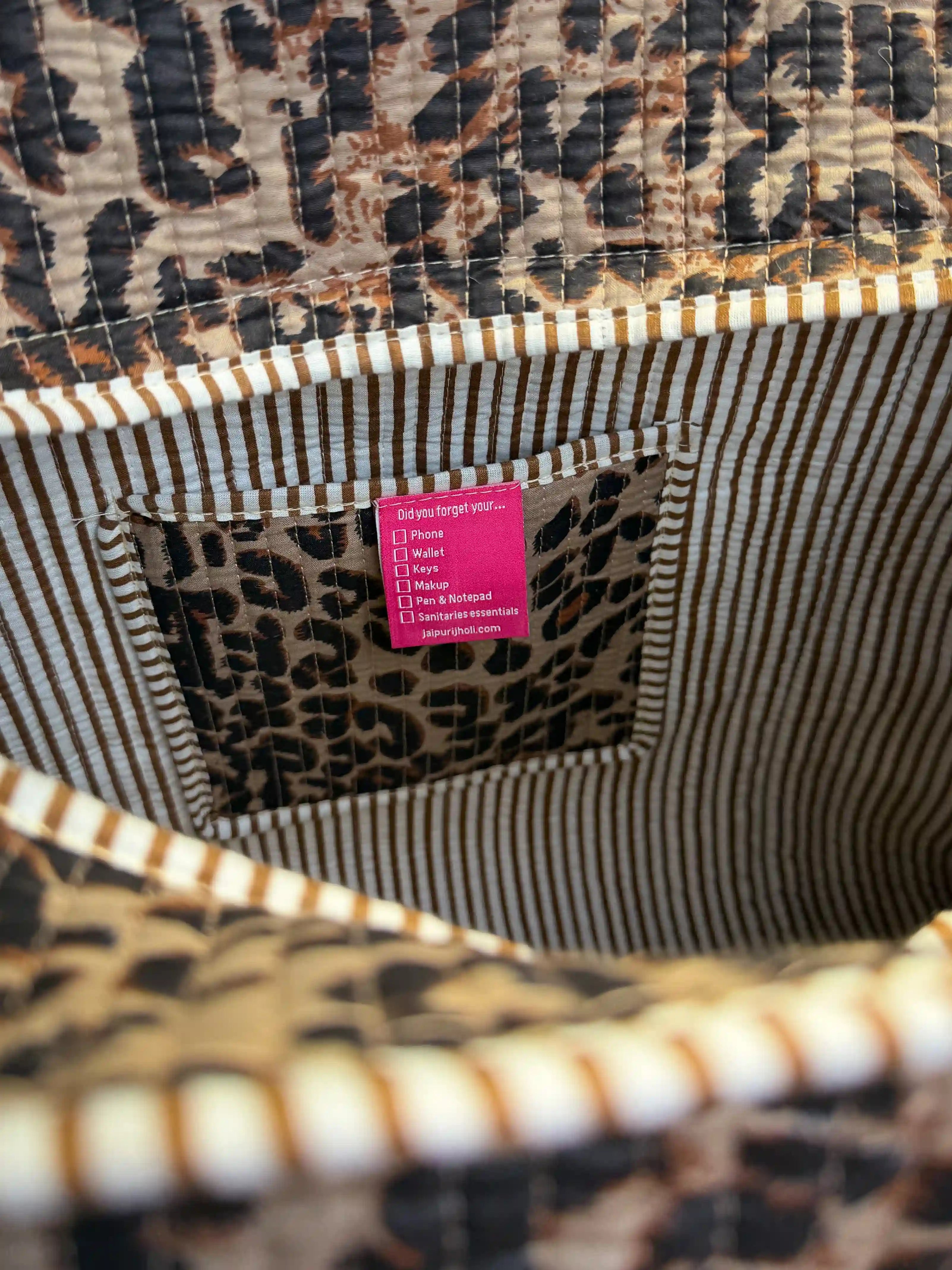 Black and brown quilted cotton open mini tote with leopard hand block pattern, lightweight animal print mini bag for daily essentials.