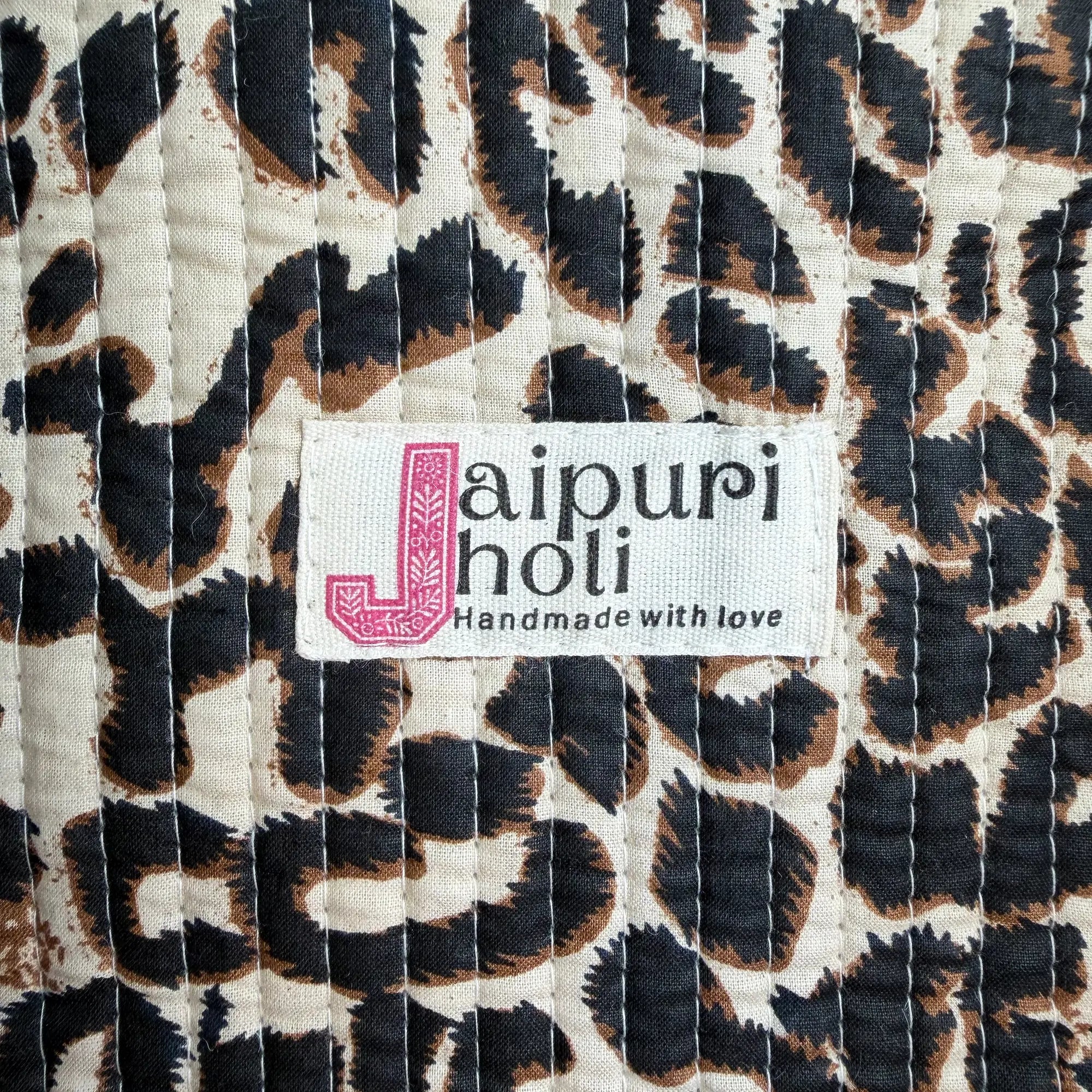 Black and cream quilted cotton open mini tote with leopard hand block pattern, stylish animal print mini bag for everyday carry.