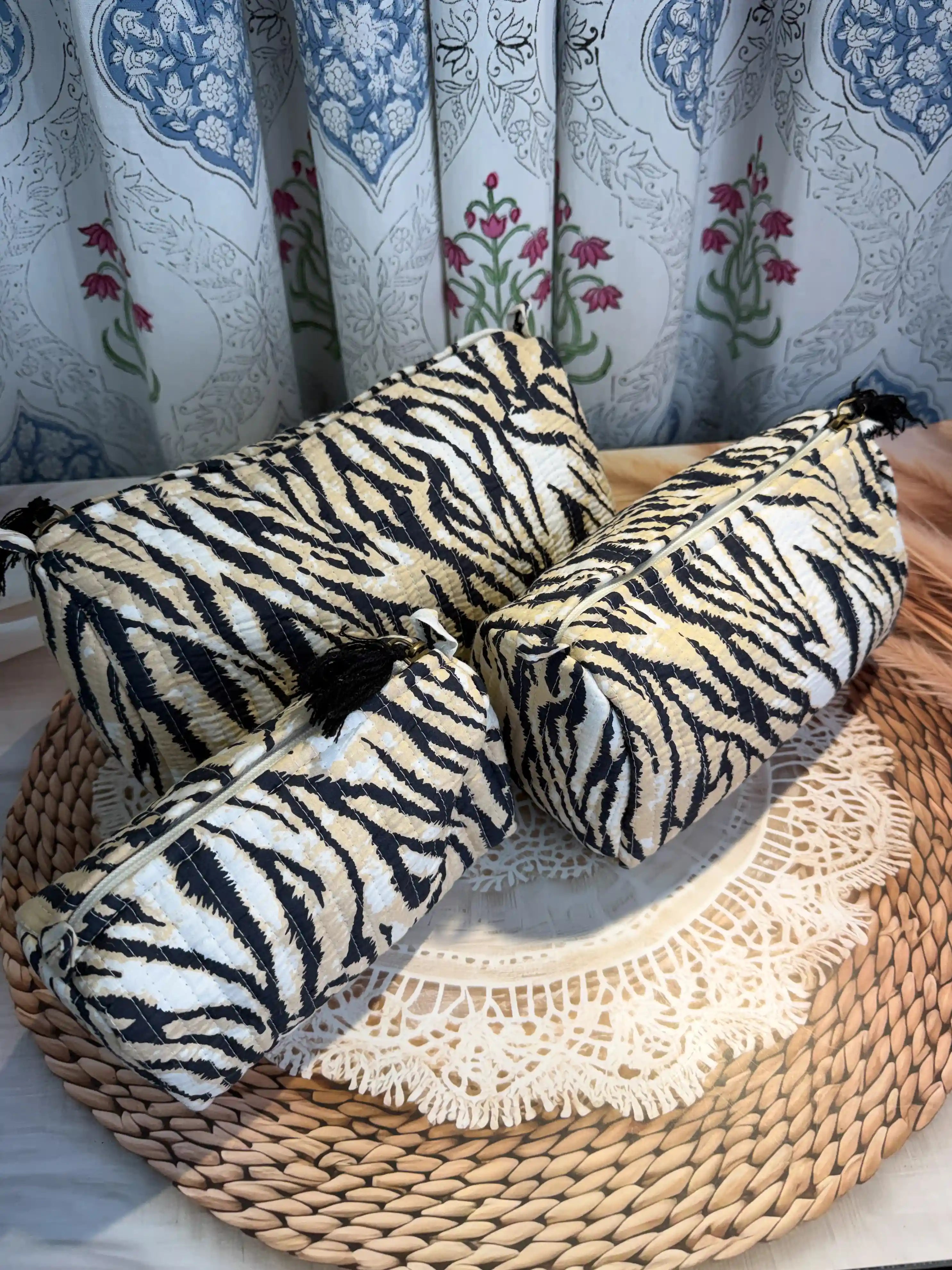 Black and white tiger stripe quilted cotton toiletry pouch set with hand block pattern, animal print three-piece lightweight organizer for bathroom essentials.