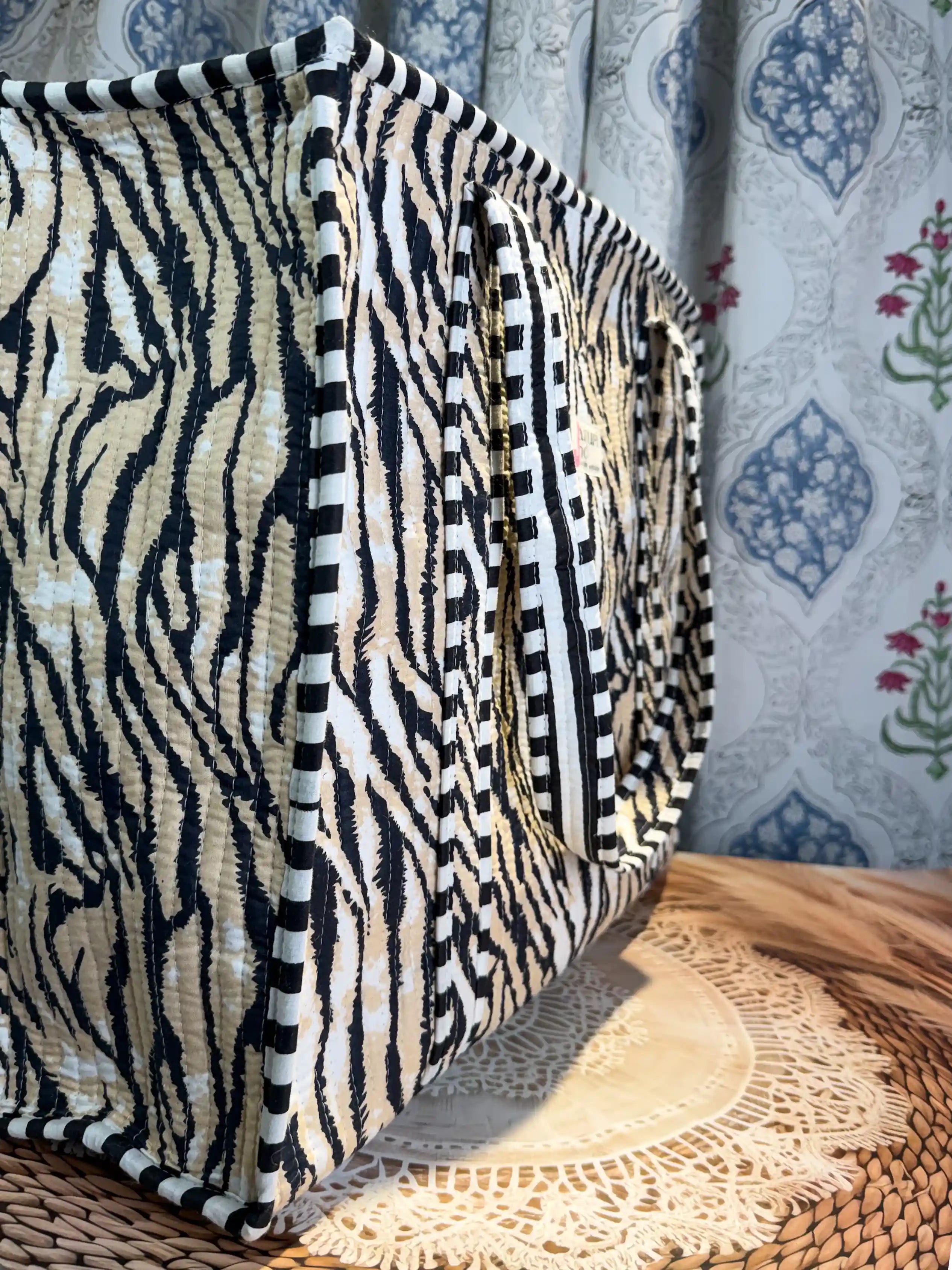 Black and white tiger stripe quilted cotton tote bag with hand block pattern and zip, striking animal print shoulder bag for everyday carry.