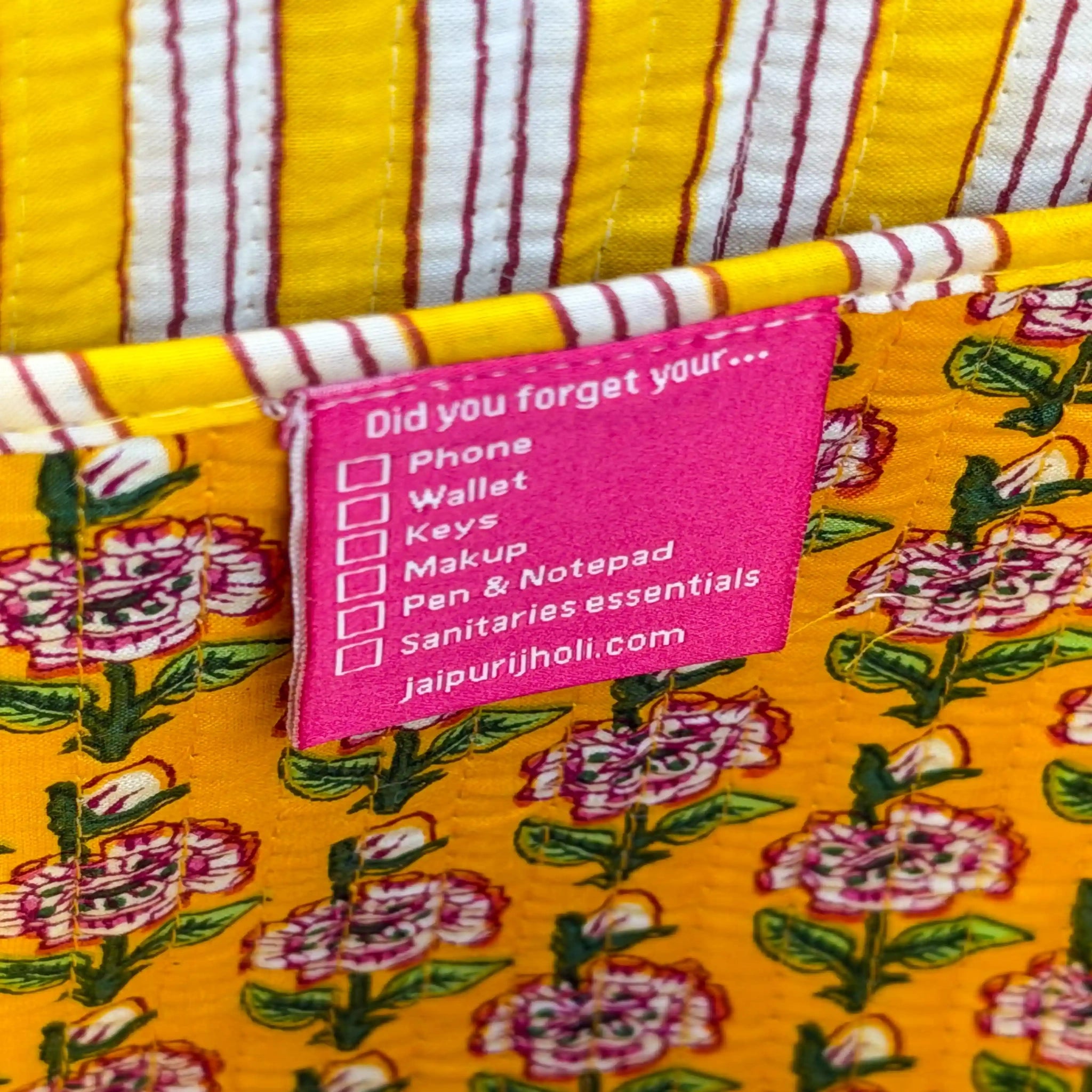 Bright yellow quilted cotton open mini tote with multicolor floral hand block print and striped borders, cheerful handcrafted mini carryall for daily use.