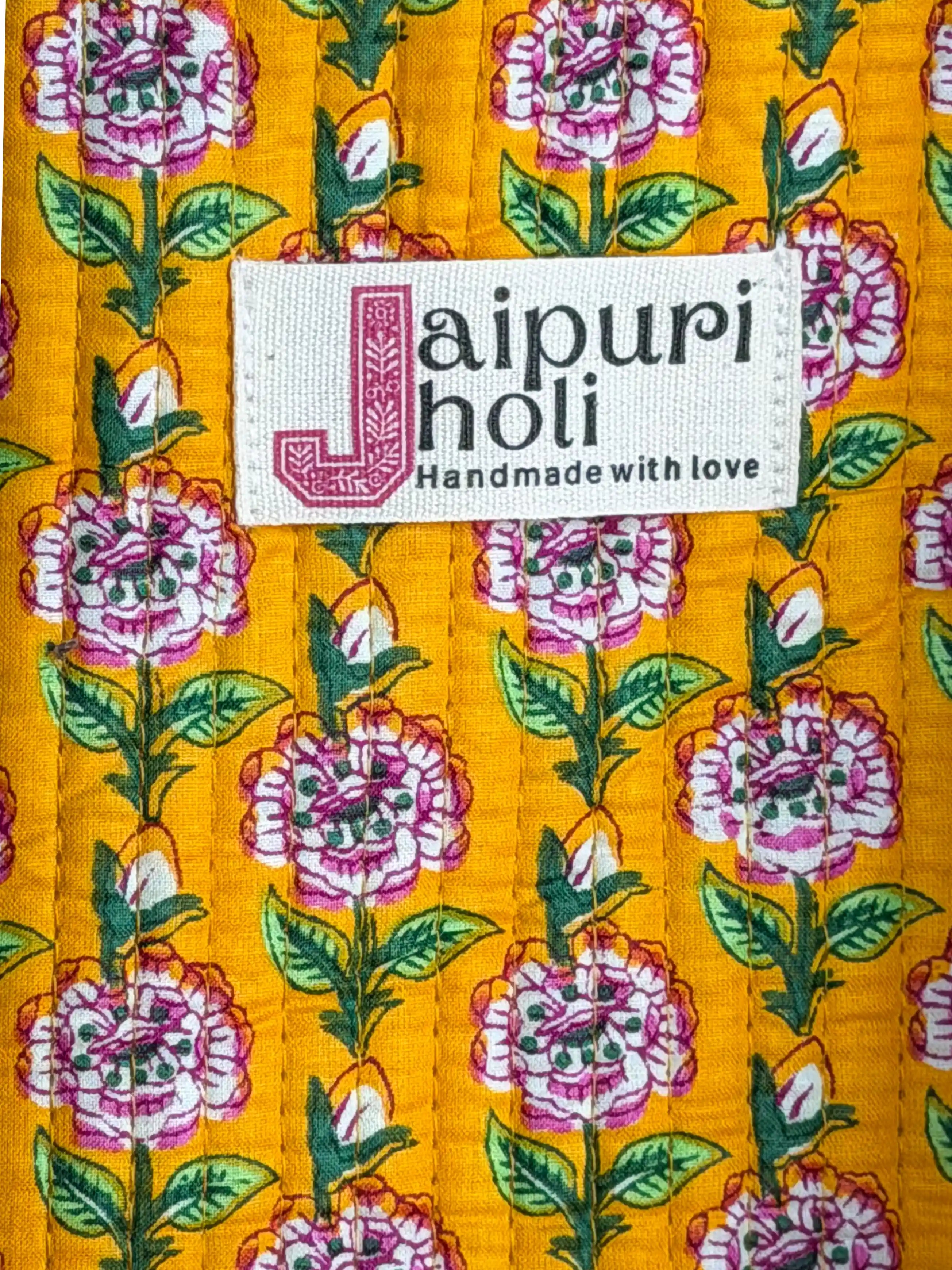 Bright yellow quilted cotton tote bag with multicolor floral hand block design, striped borders, and zip, cheerful handcrafted carryall for daily use.