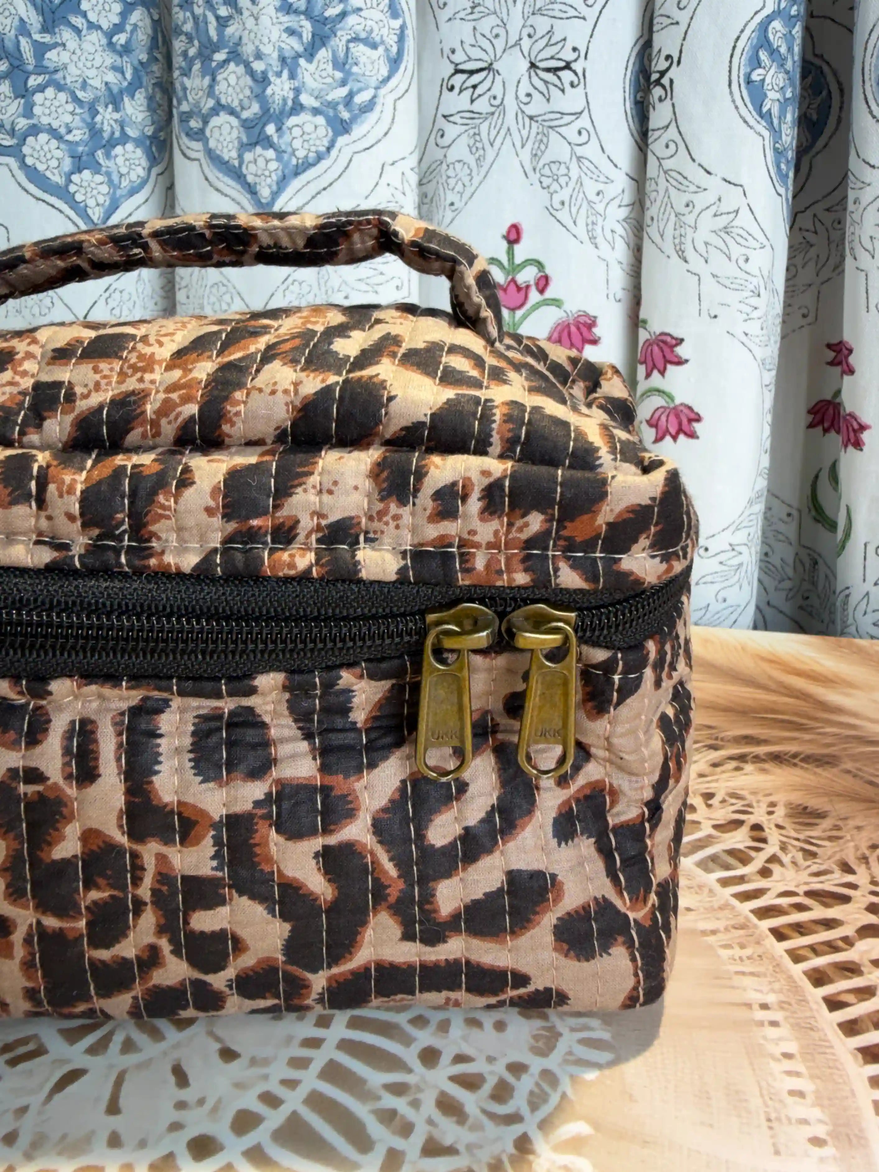 Brown quilted cotton cosmetic vanity bag with leopard print hand block pattern, animal print makeup organizer for travel and daily use
