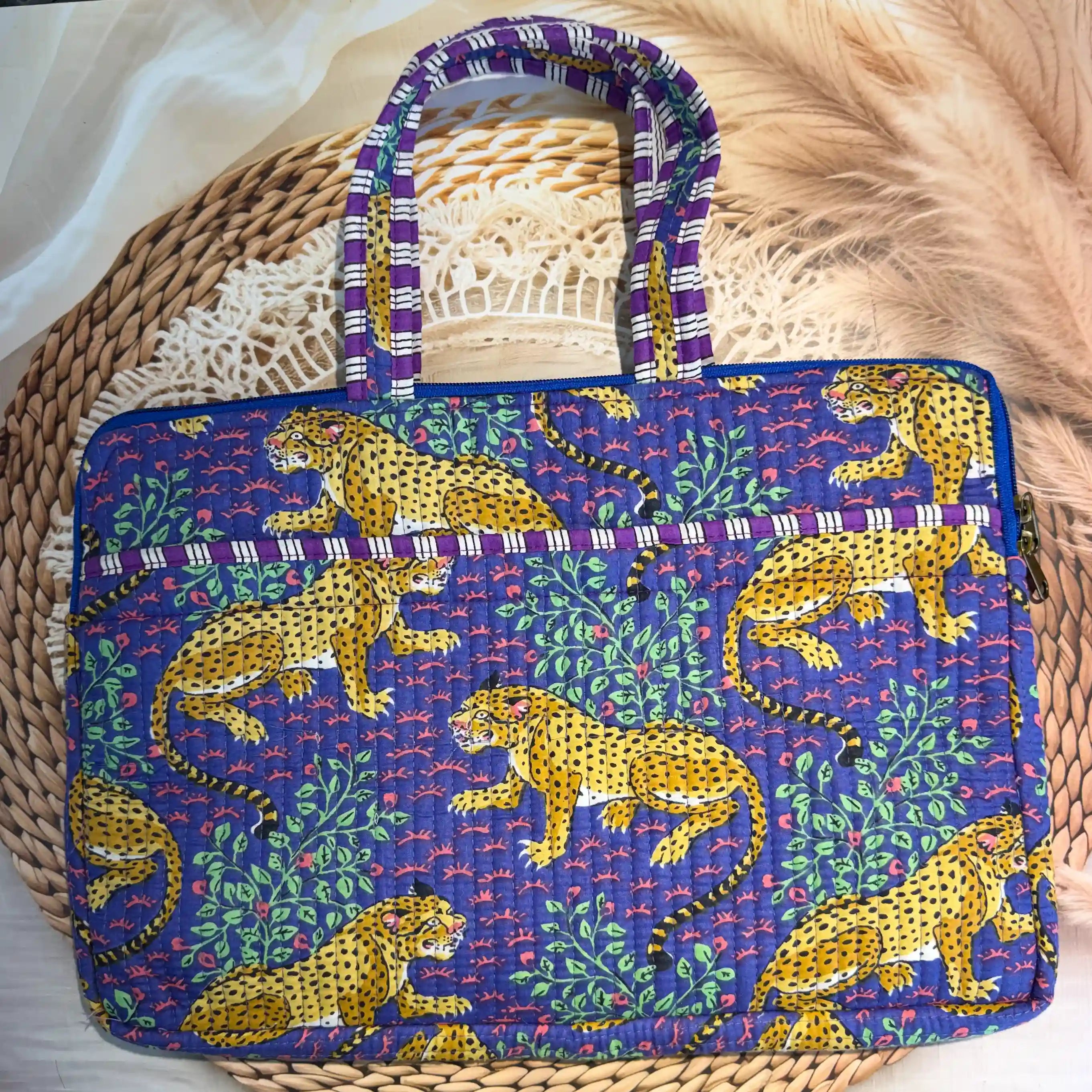 Deep navy quilted cotton laptop bag with yellow elephant print hand block design and purple striped borders, animal print padded laptop sleeve