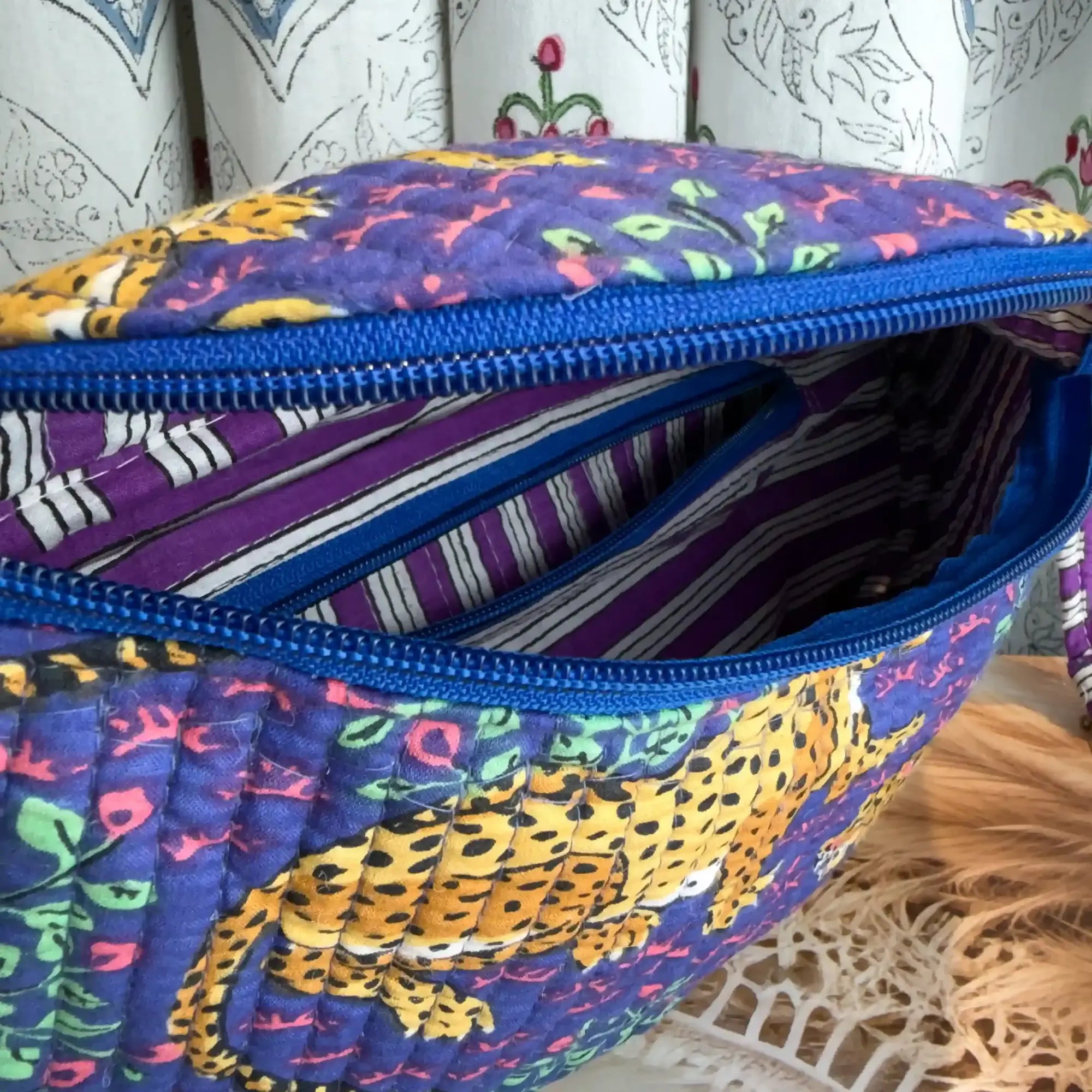 Deep blue quilted cotton fanny bag with yellow print hand block design, purple geometric strap for hands-free daily wear