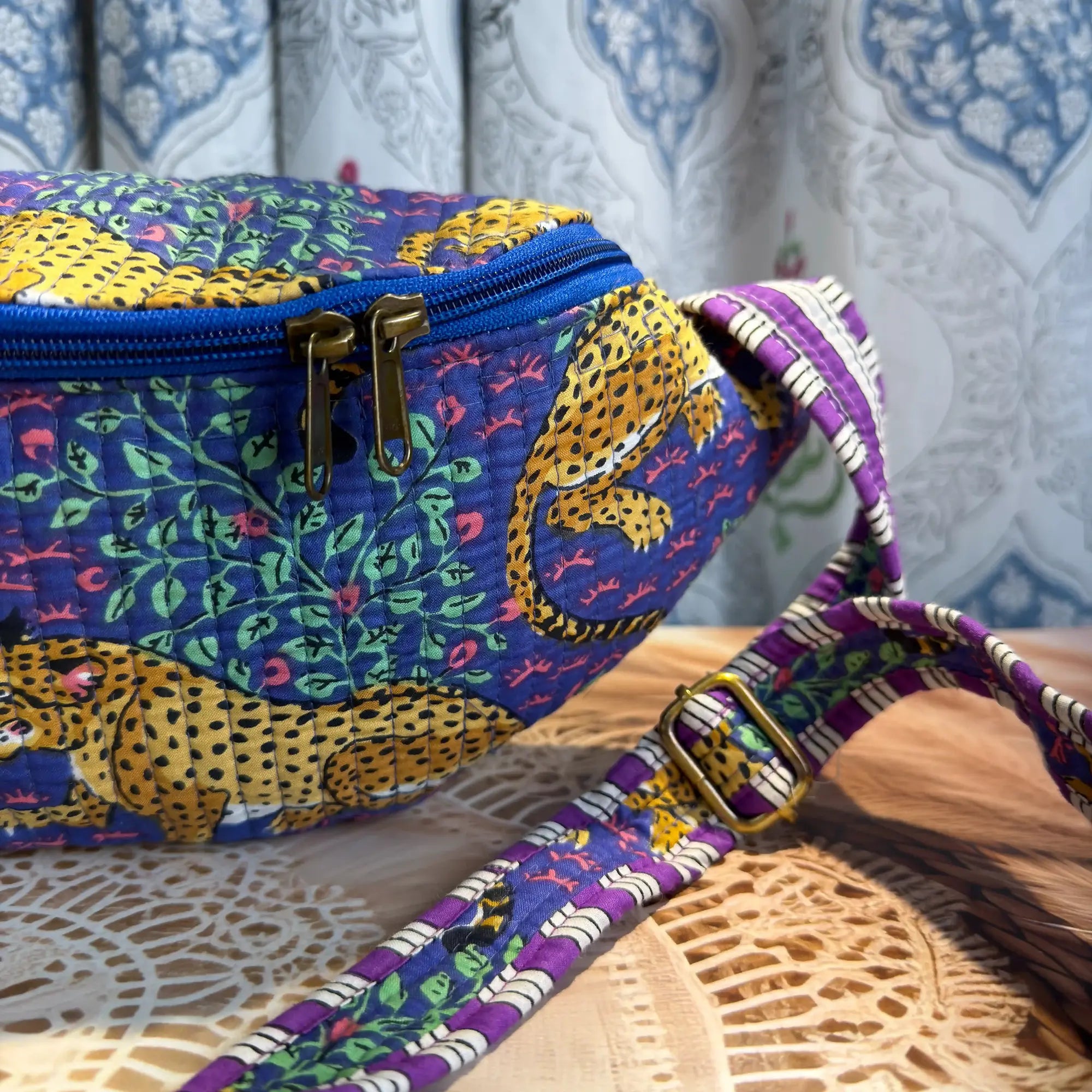 Deep blue quilted cotton fanny bag with yellow print hand block design, purple geometric strap for hands-free daily wear