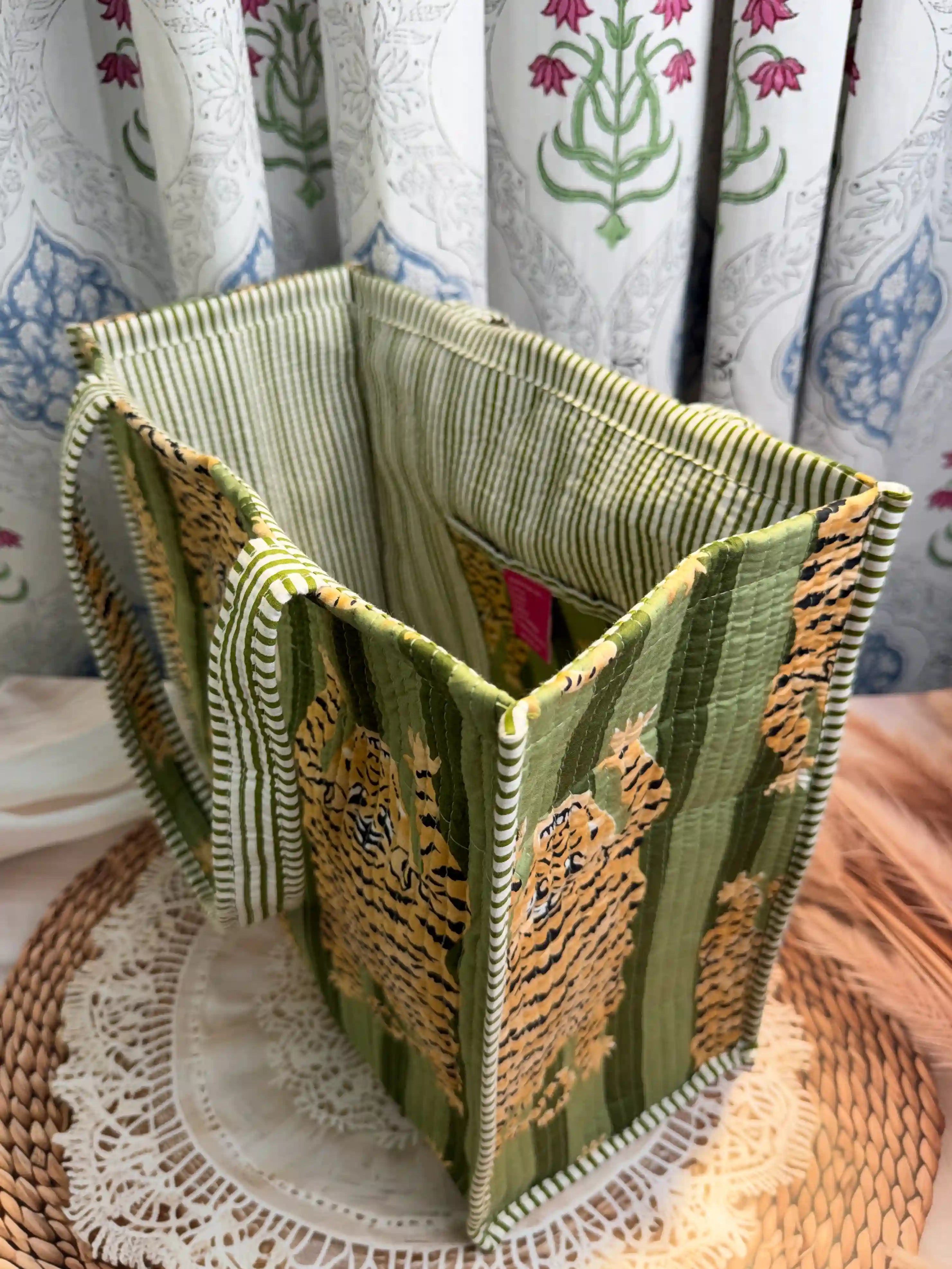 Green quilted cotton open mini tote featuring tiger hand block print, compact animal print shoulder bag for daily use and travel.
