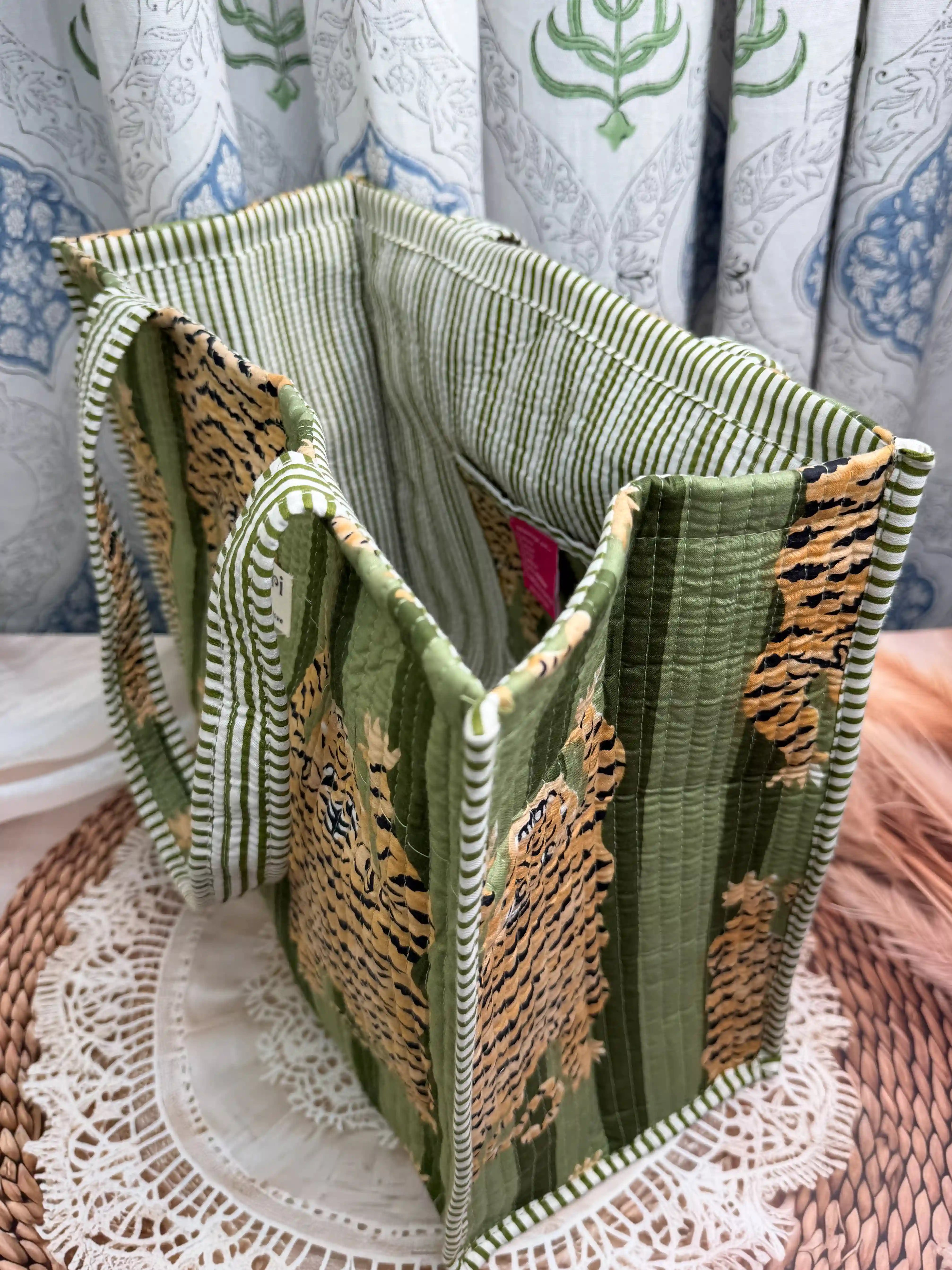 Green quilted cotton open mini tote featuring tiger hand block print, compact animal print shoulder bag for daily use and travel.
