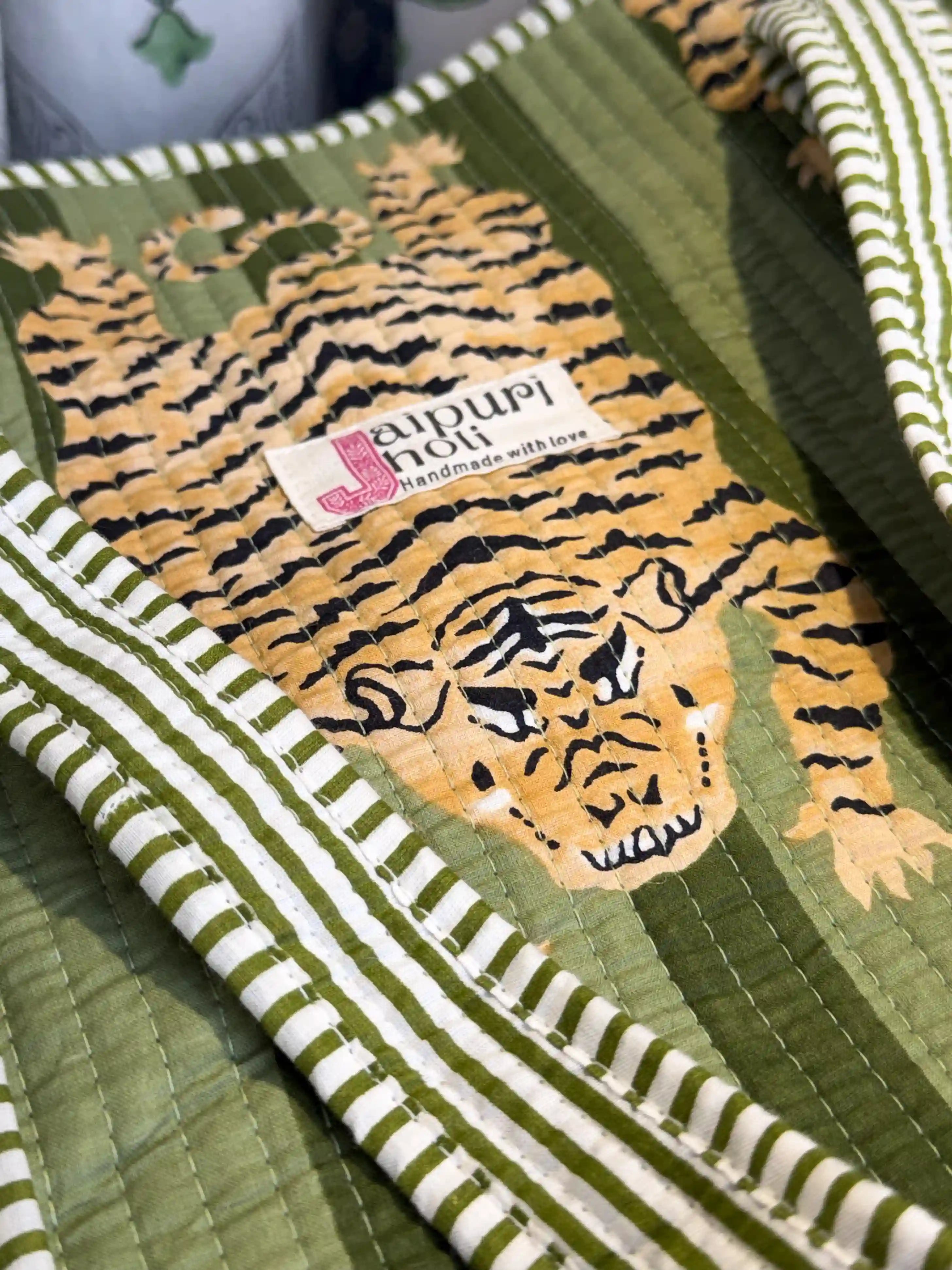 Green quilted cotton open mini tote featuring tiger hand block print, compact animal print shoulder bag for daily use and travel.
