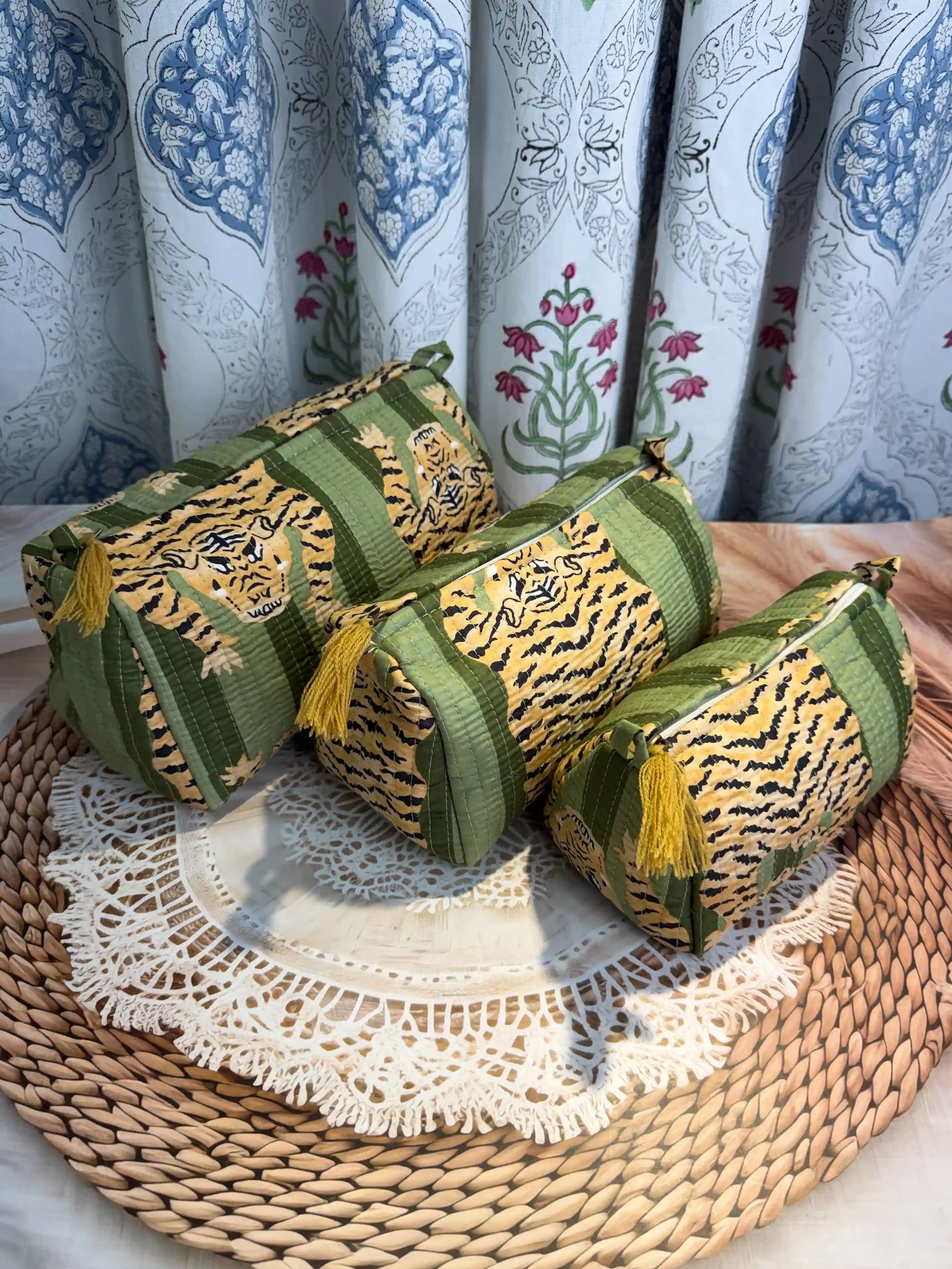 Green quilted cotton toiletry pouch set with yellow tiger print hand block pattern, animal print three-piece handmade travel organizer for toiletries.