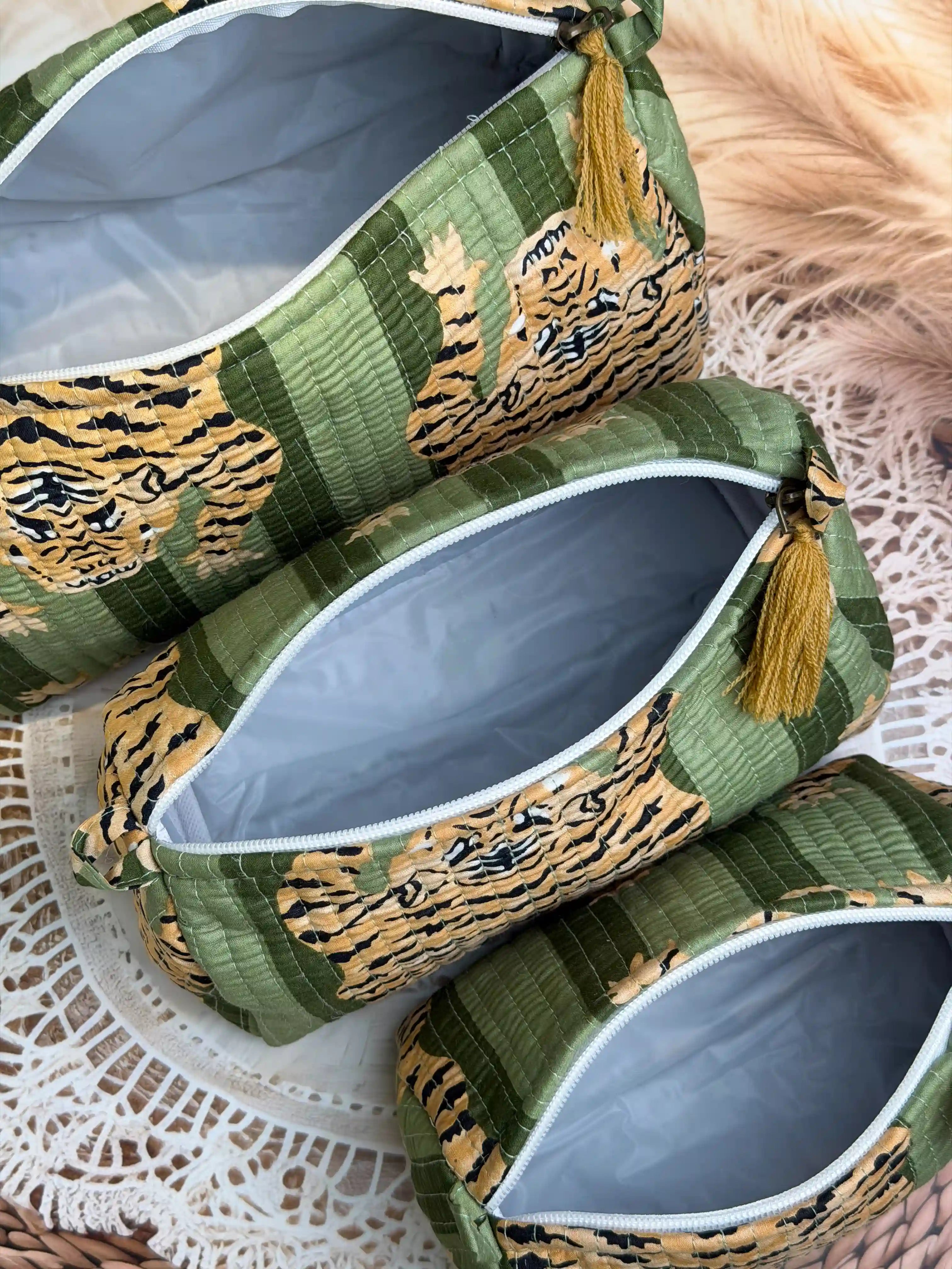 Green quilted cotton toiletry pouch set with yellow tiger print hand block pattern, animal print three-piece handmade travel organizer for toiletries.