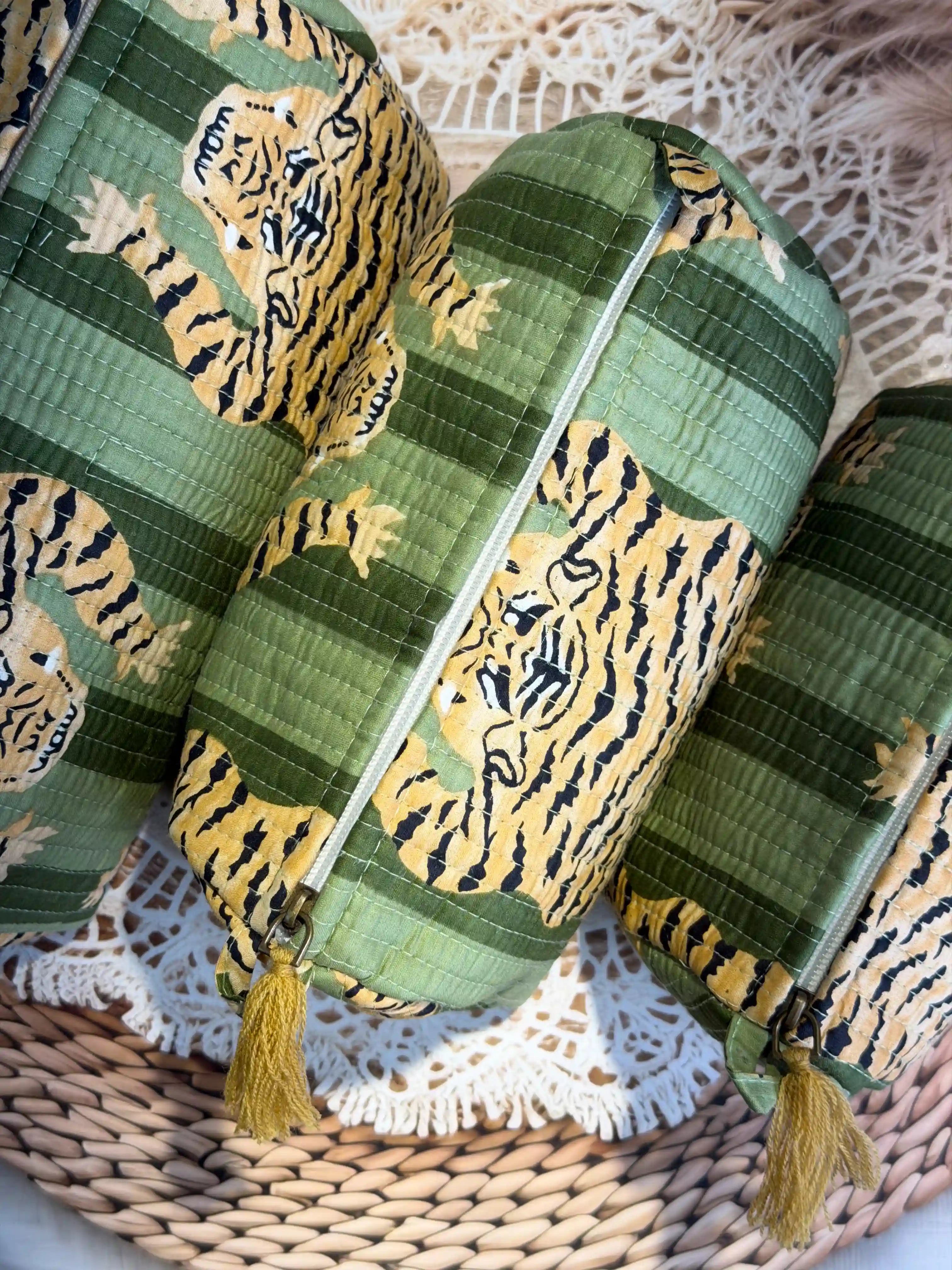 Green quilted cotton toiletry pouch set with yellow tiger print hand block pattern, animal print three-piece handmade travel organizer for toiletries.