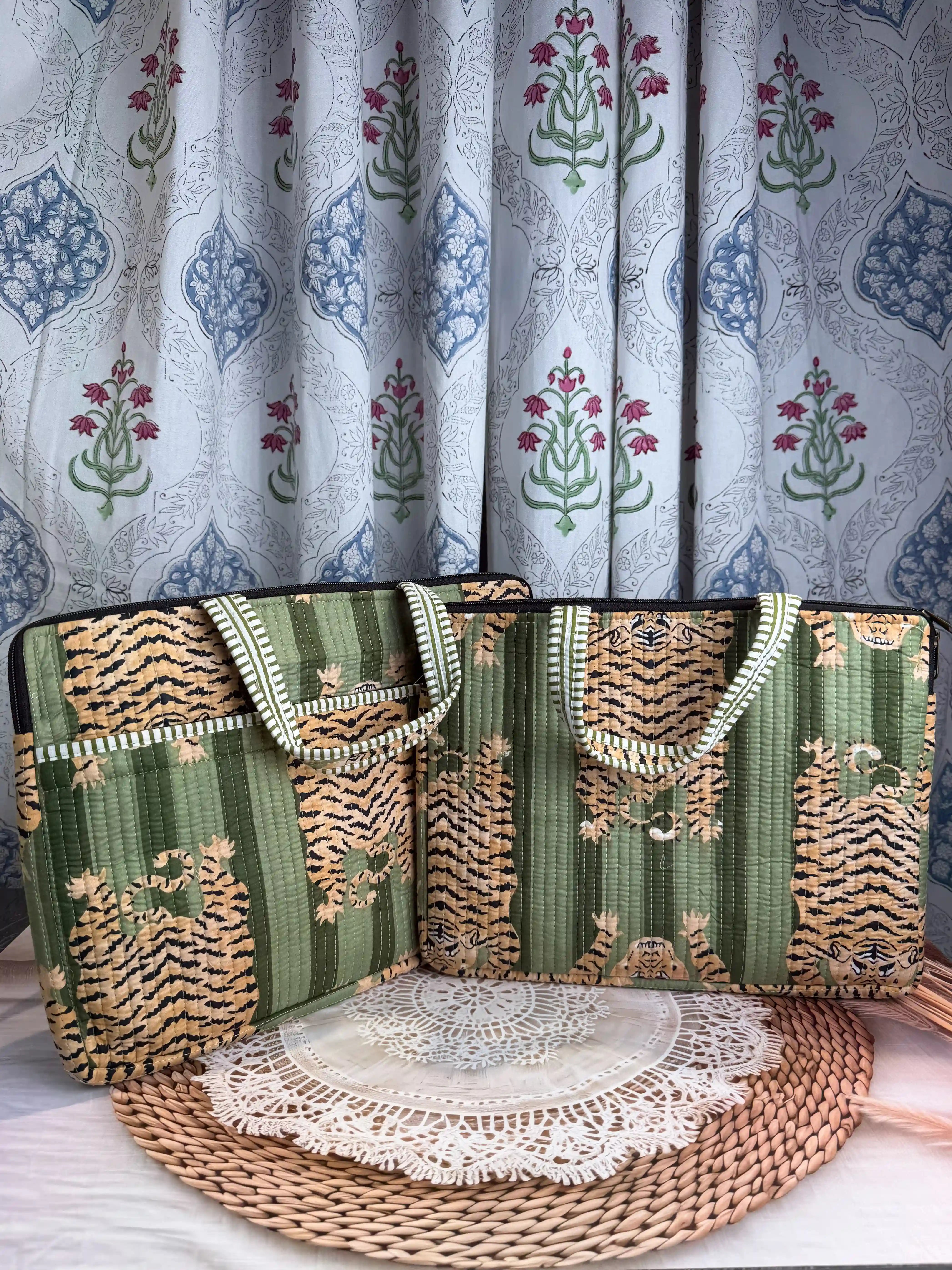 Green quilted cotton laptop bag with tiger print hand block pattern and white striped borders, padded handmade sleeve for office and travel