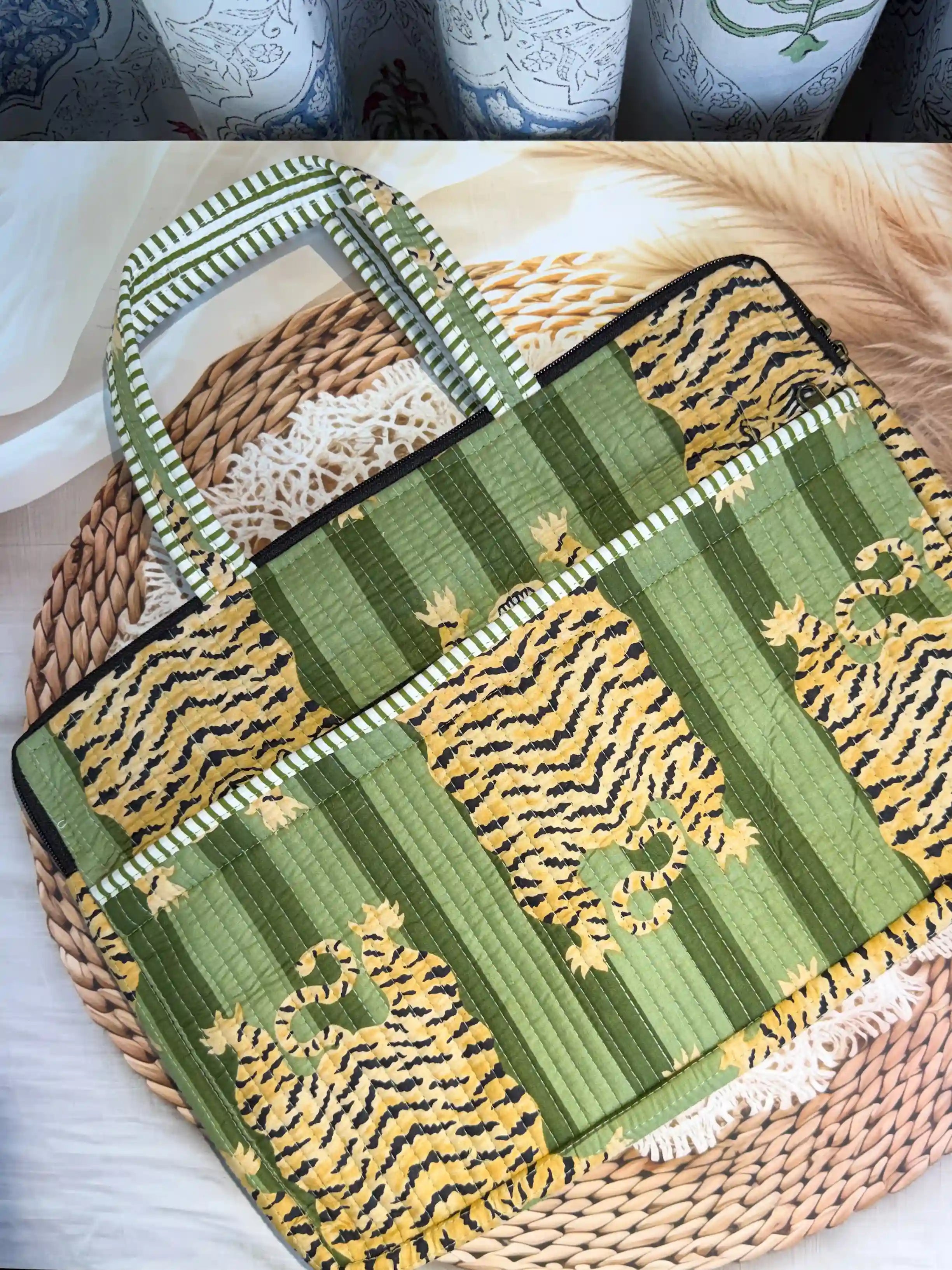 Green quilted cotton laptop bag with tiger print hand block pattern and white striped borders, padded handmade sleeve for office and travel