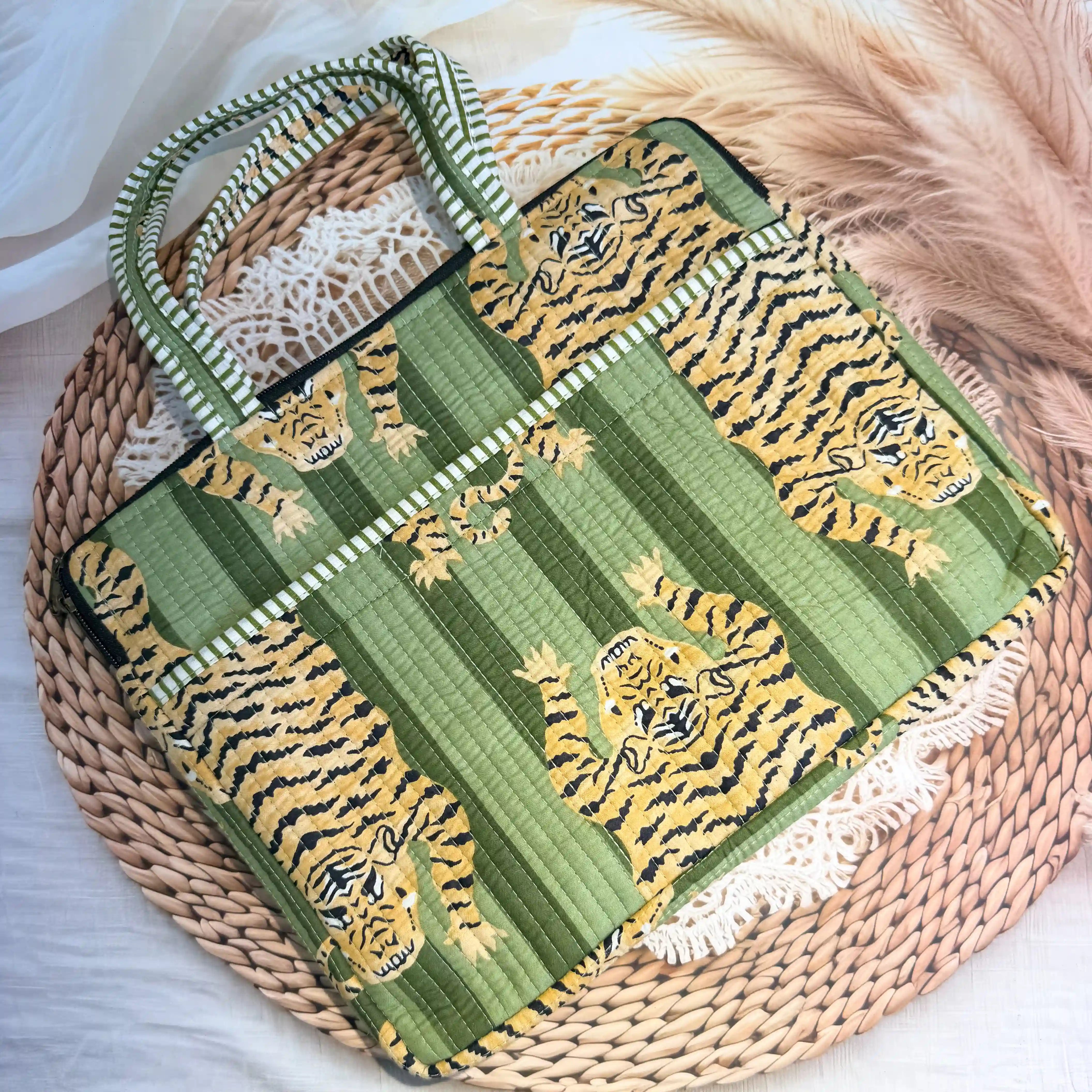 Green quilted cotton laptop bag with tiger print hand block pattern and white striped borders, padded handmade sleeve for office and travel