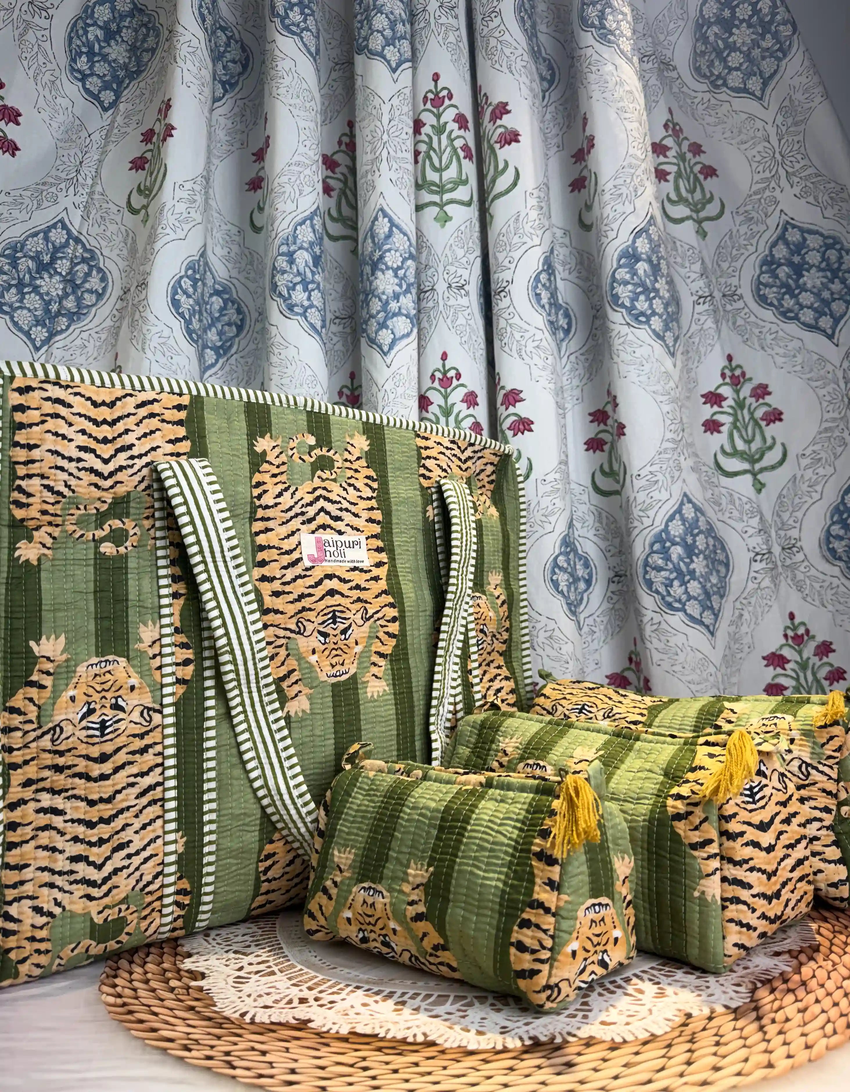Handcrafted green cotton quilted tote bag with tiger print design and sturdy striped handles, paired with a matching 3-piece zippered toiletry pouch set, featuring soft quilted finish, single compartments, and ethical craftsmanship from Jaipur, India, ideal for everyday use, travel, cosmetics, skincare, and innerwear storage