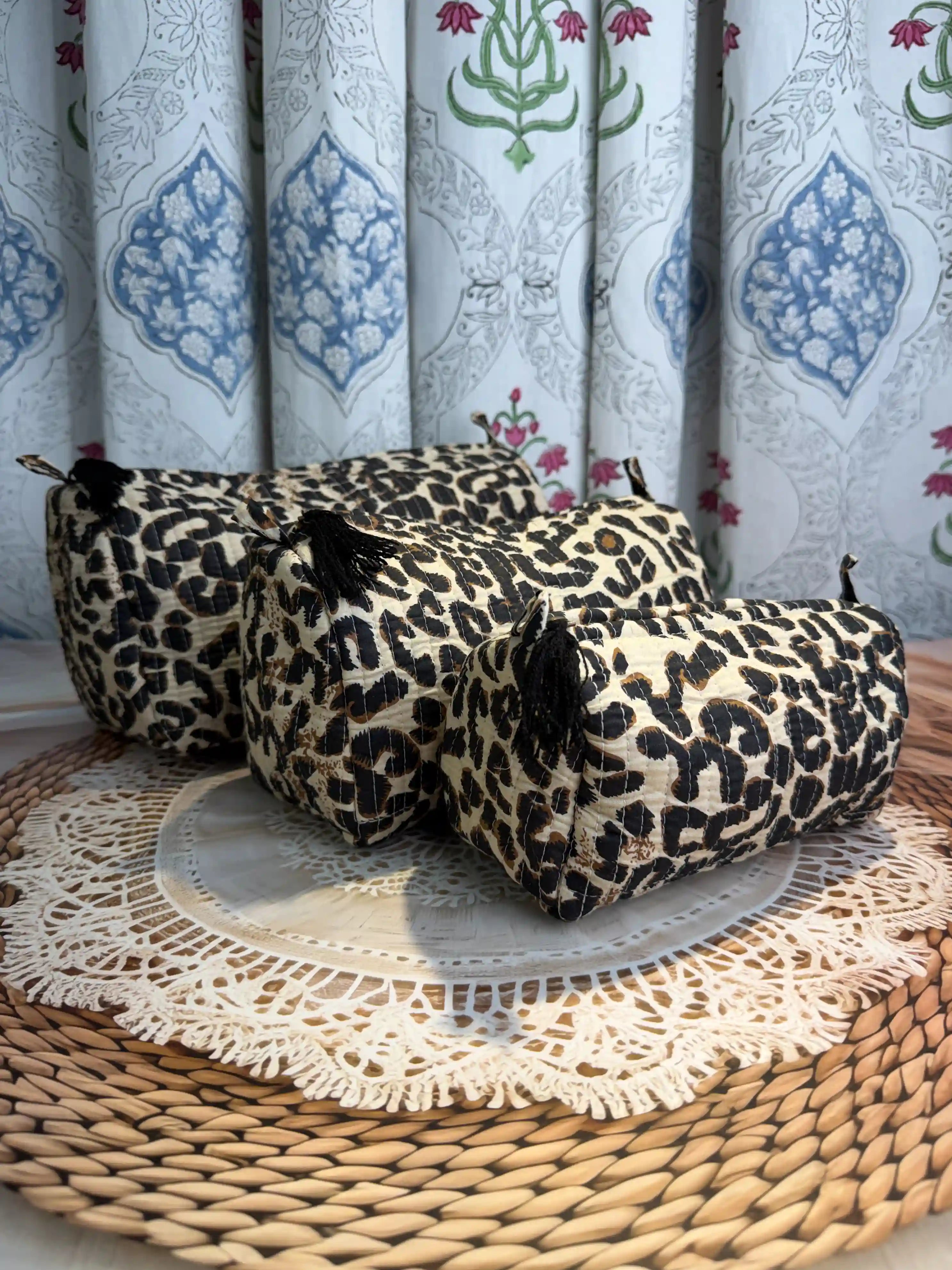 Handcrafted leopard print cotton quilted tote bag with sturdy handles and matching 3-piece toiletry pouch set, featuring zip closure and spacious single compartments, ethically made in Jaipur, India, ideal for everyday use, travel, skincare, cosmetics, and innerwear storage.