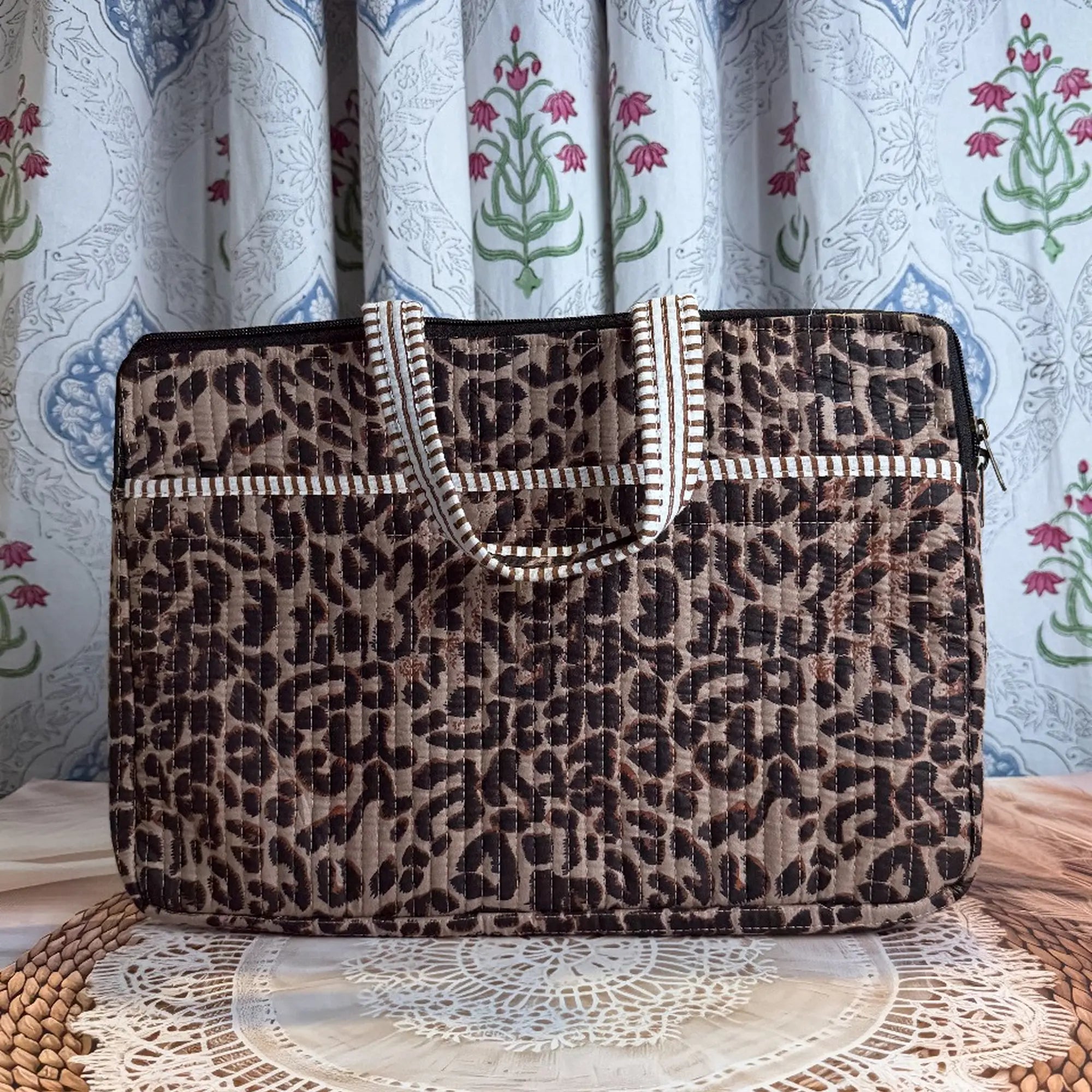 Brown quilted cotton laptop bag with leopard print hand block design and cream striped borders, animal print padded laptop sleeve