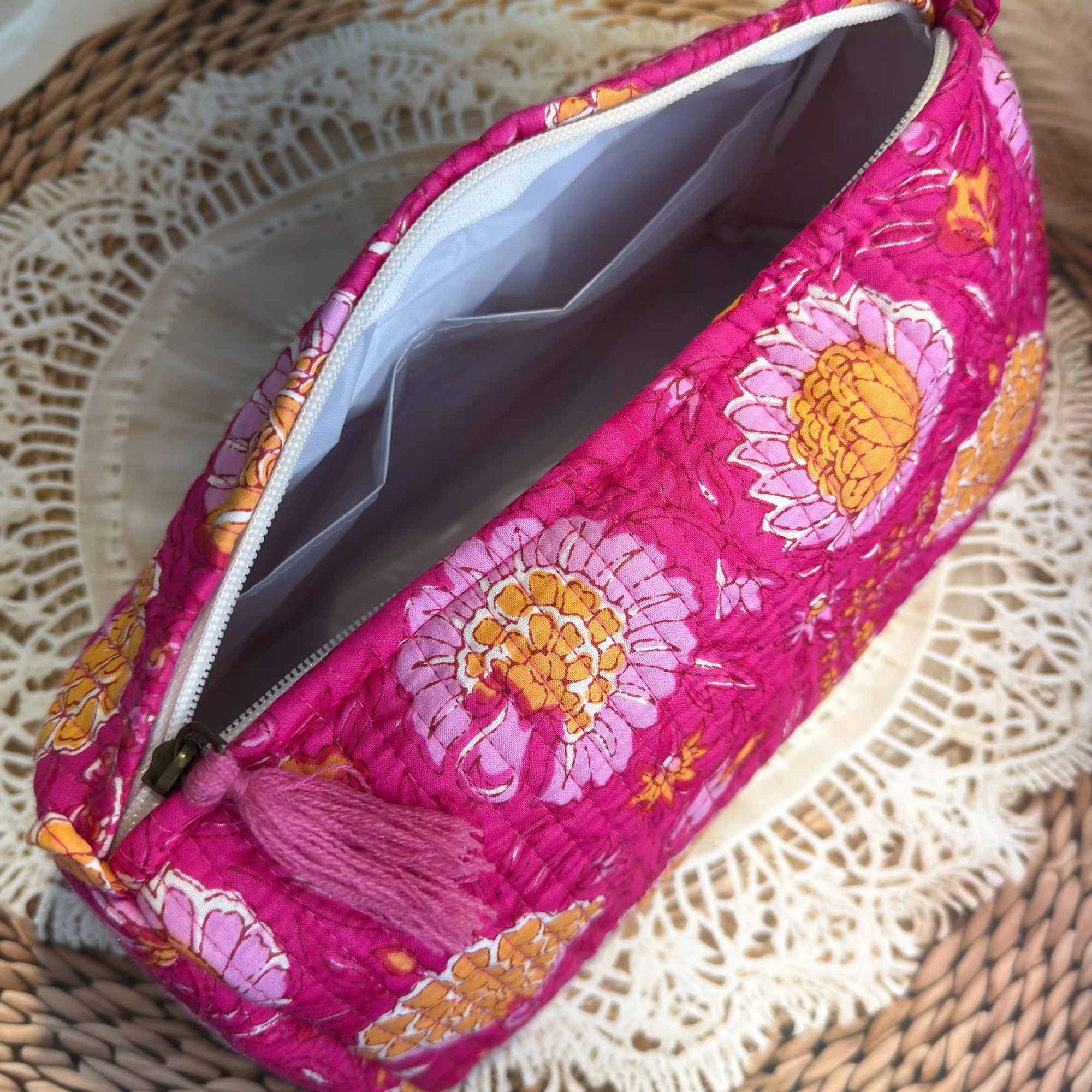 Pink quilted cotton toiletry pouch set with multicolor hand block print, lightweight three-piece handcrafted travel organizer.