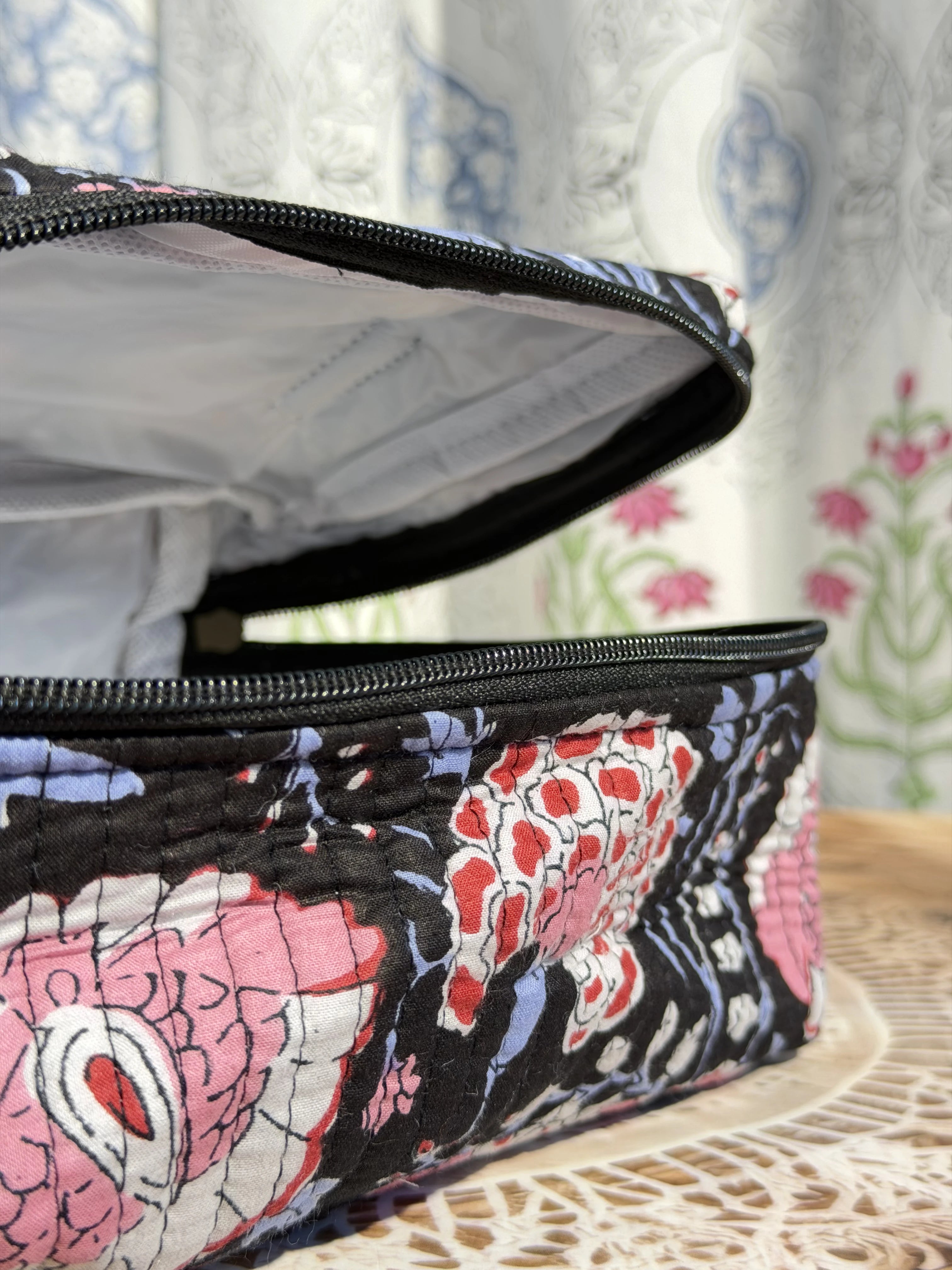 Jaipur Block Print Quilted Travel Makeup Bag for Women - Black and Pink Floral Close-Up View