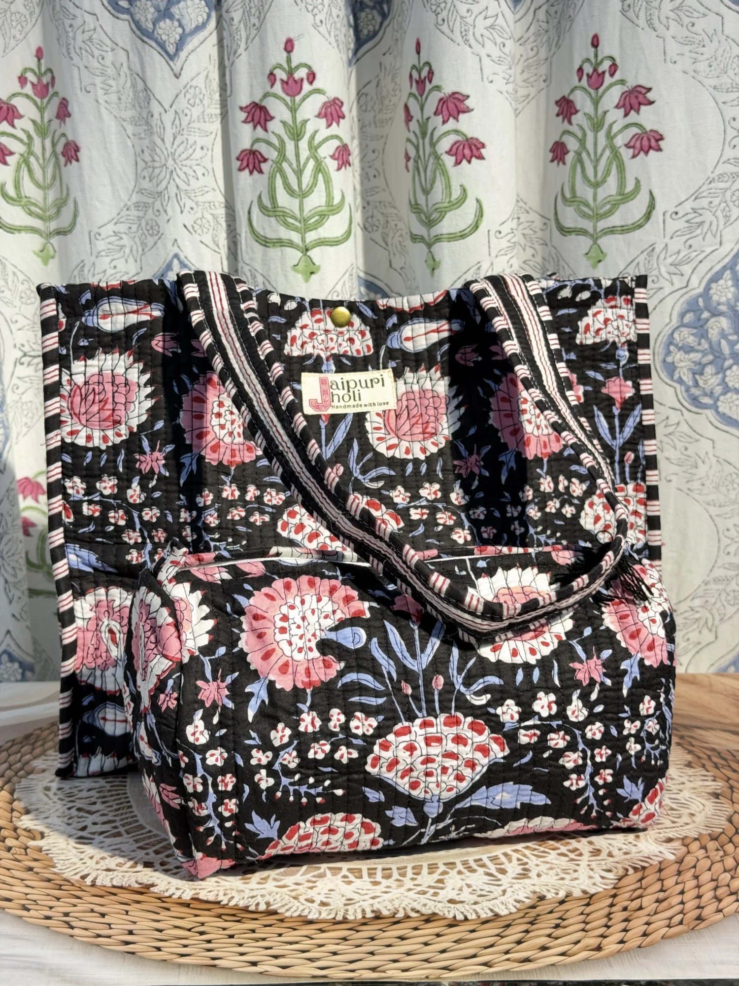 Jaipur block print cotton quilted button tote bag with matching pouch, black and pink floral print, 15×12×6 inch tote with 10×6 inch pouch for storing toiletries, cosmetics and daily essentials side view