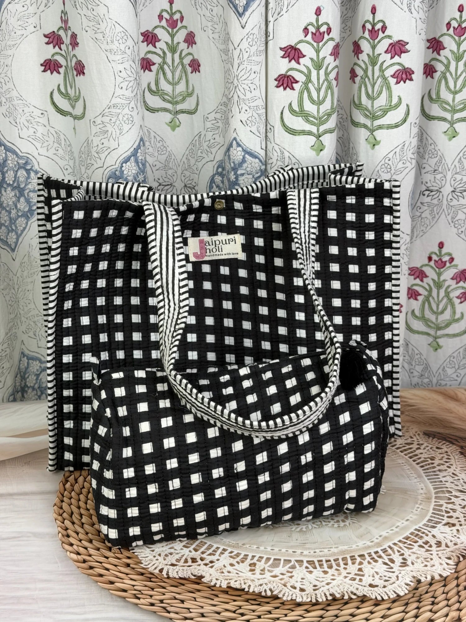 Jaipur block print cotton quilted button tote bag with matching pouch, black and white geometric check print, 15×12×6 inch tote with 10×6 inch pouch for organizing toiletries, cosmetics and medicines front view