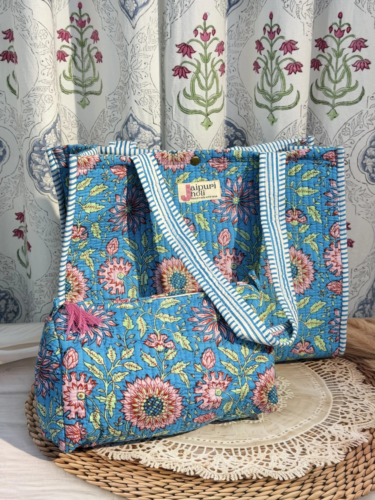 Jaipur block print cotton quilted button tote bag with matching pouch, blue floral print, 15×12×6 inch tote with 10×6 inch pouch for organizing toiletries, cosmetics and travel essentials close-up view
