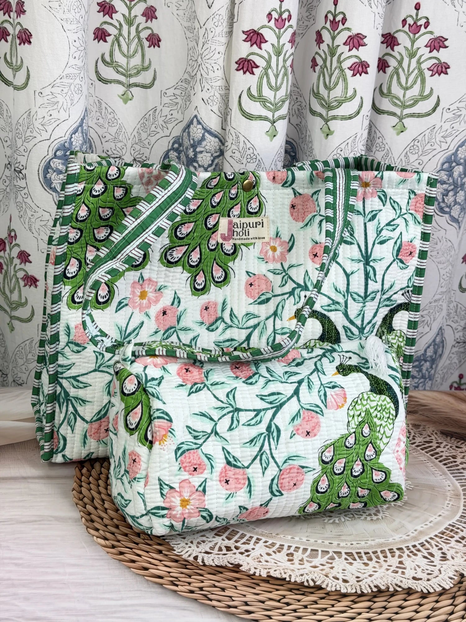 Jaipur block print cotton quilted button tote bag with matching pouch, green and pink peacock print, 15×12×6 inch tote with 10×6 inch pouch for organizing toiletries, cosmetics and everyday essentials front view