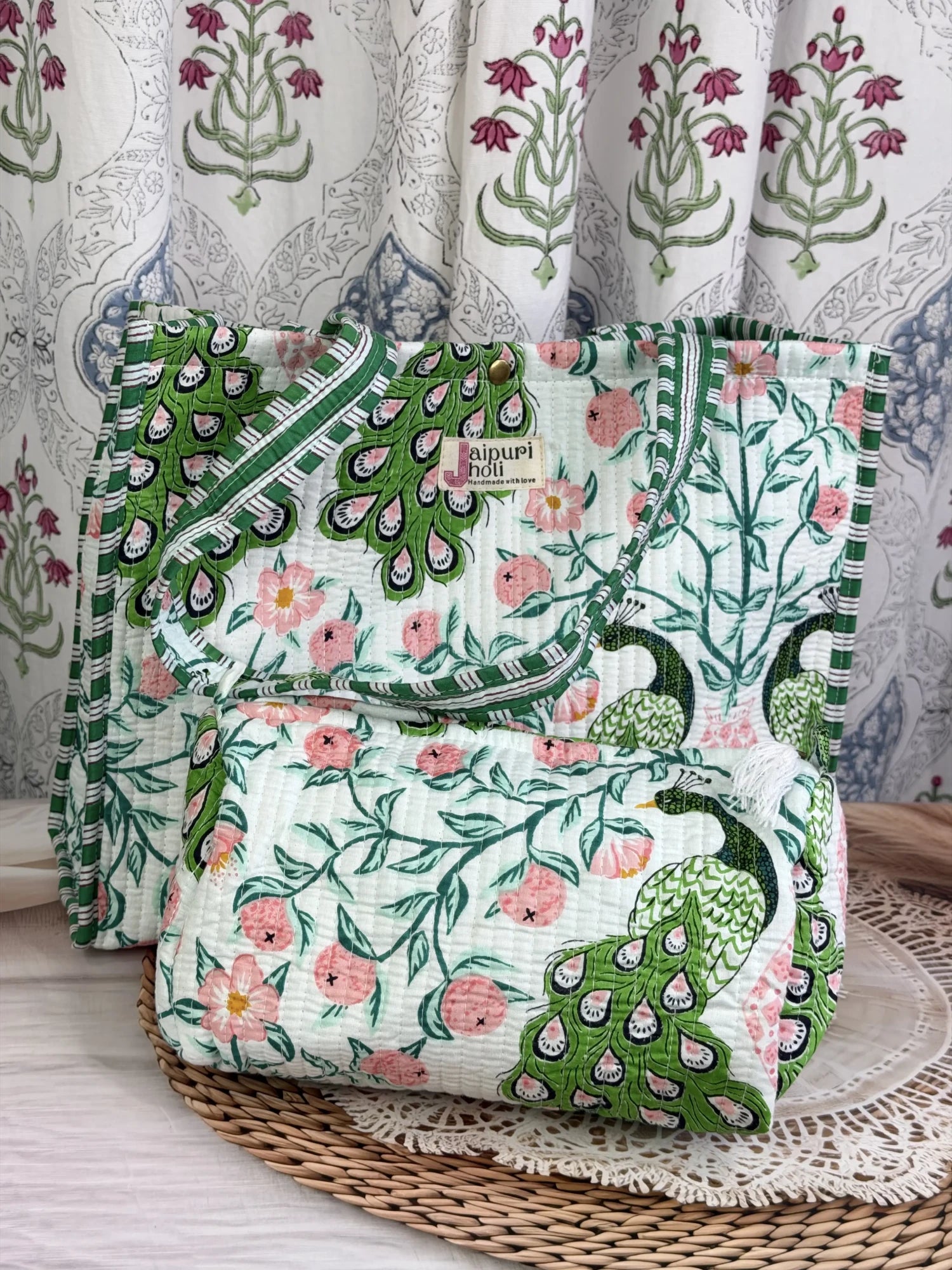 Jaipur block print cotton quilted button tote bag with matching pouch, green and pink peacock print, 15×12×6 inch tote with 10×6 inch pouch for organizing toiletries, cosmetics and everyday essentials side view