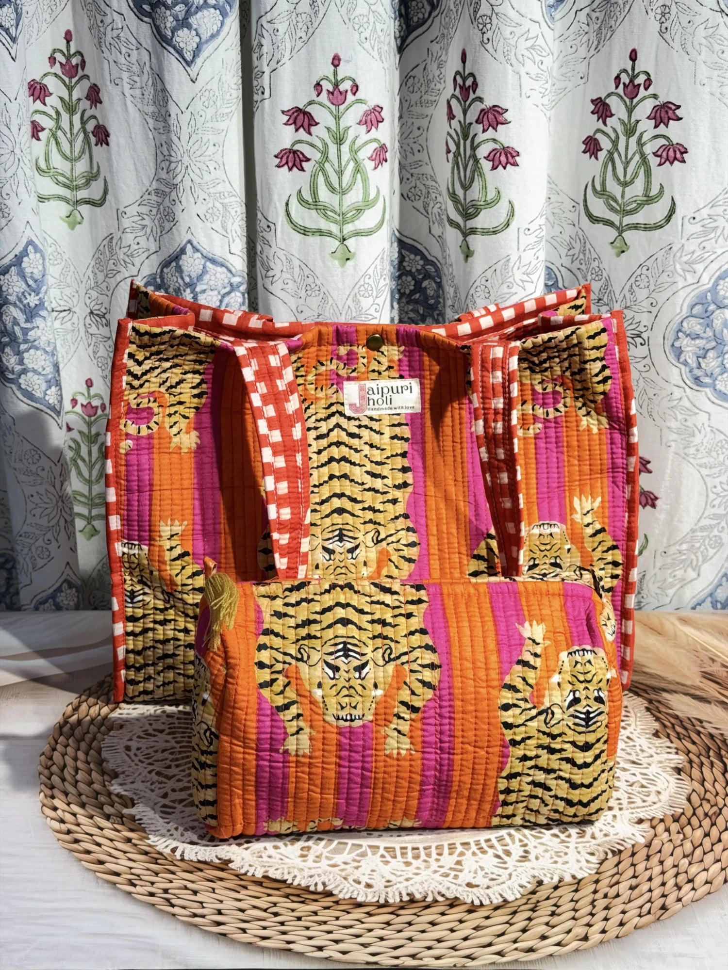 Jaipur block print cotton quilted button tote bag with matching pouch, orange and pink tiger animal print, 15×12×6 inch tote with 10×6 inch pouch for storing toiletries, cosmetics and medicines front view