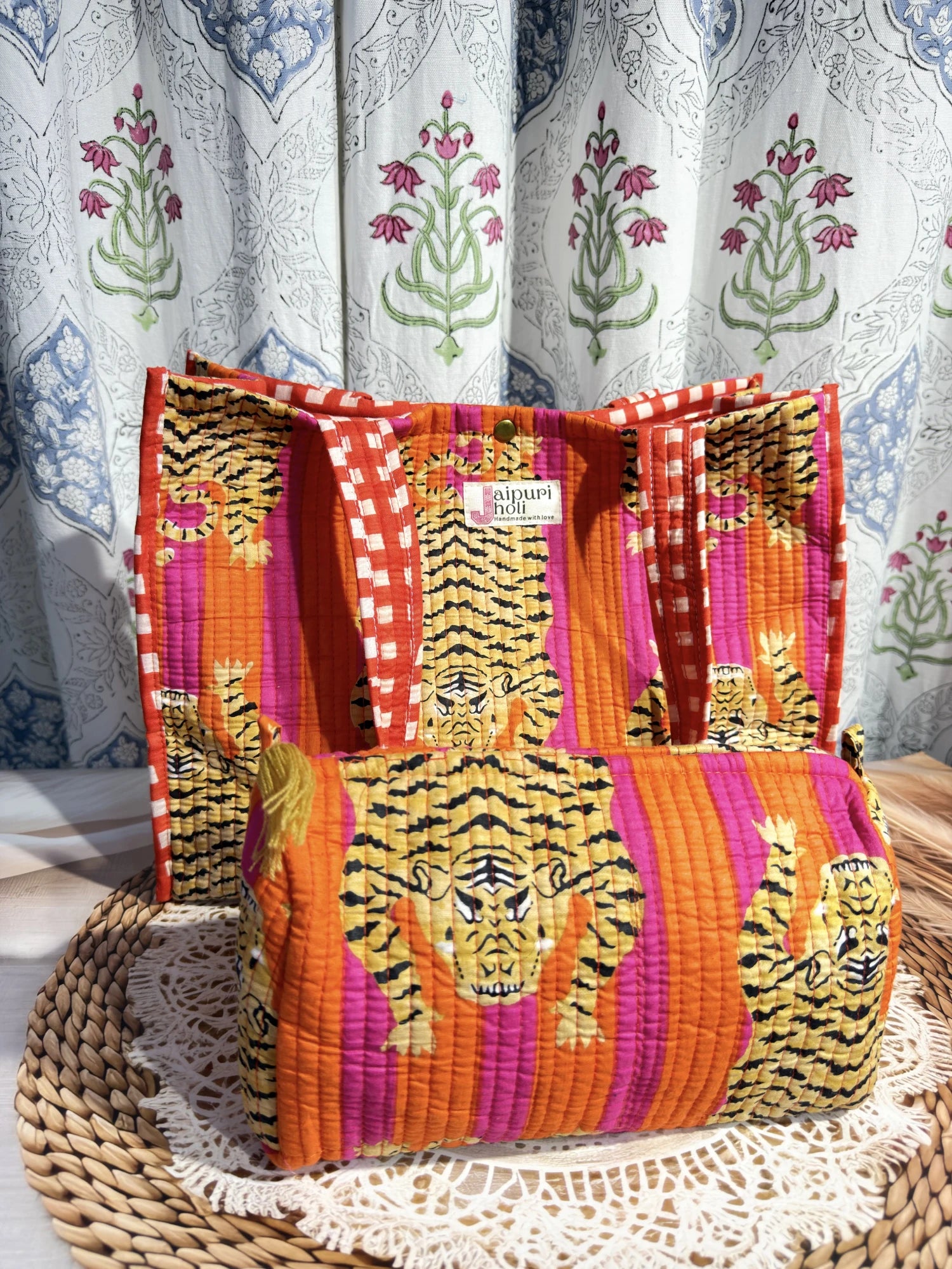 Jaipur block print cotton quilted button tote bag with matching pouch, orange and pink tiger animal print, 15×12×6 inch tote with 10×6 inch pouch for storing toiletries, cosmetics and medicines side view