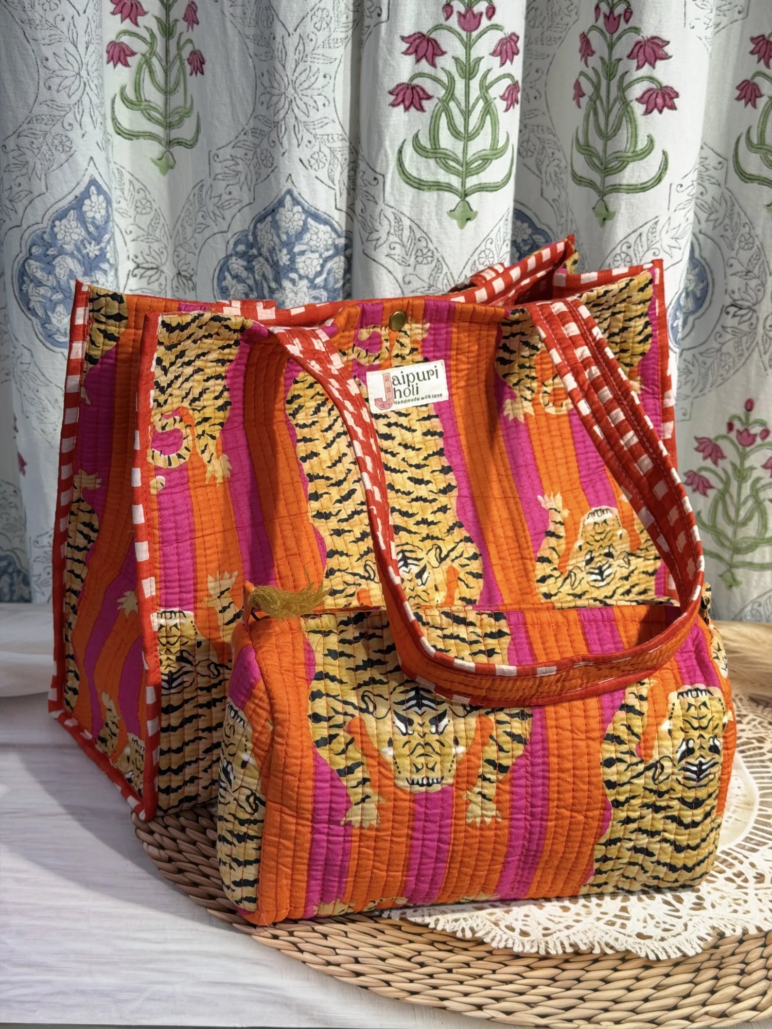 Jaipur block print cotton quilted button tote bag with matching pouch, orange and pink tiger animal print, 15×12×6 inch tote with 10×6 inch pouch for storing toiletries, cosmetics and medicines back view