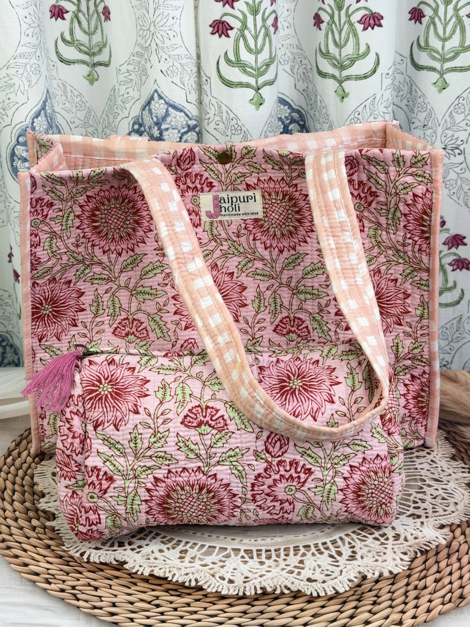 Jaipur block print cotton quilted button tote bag with matching pouch, peach and pink floral print, 15×12×6 inch tote with 10×6 inch pouch for organizing toiletries, cosmetics and small essentials front view