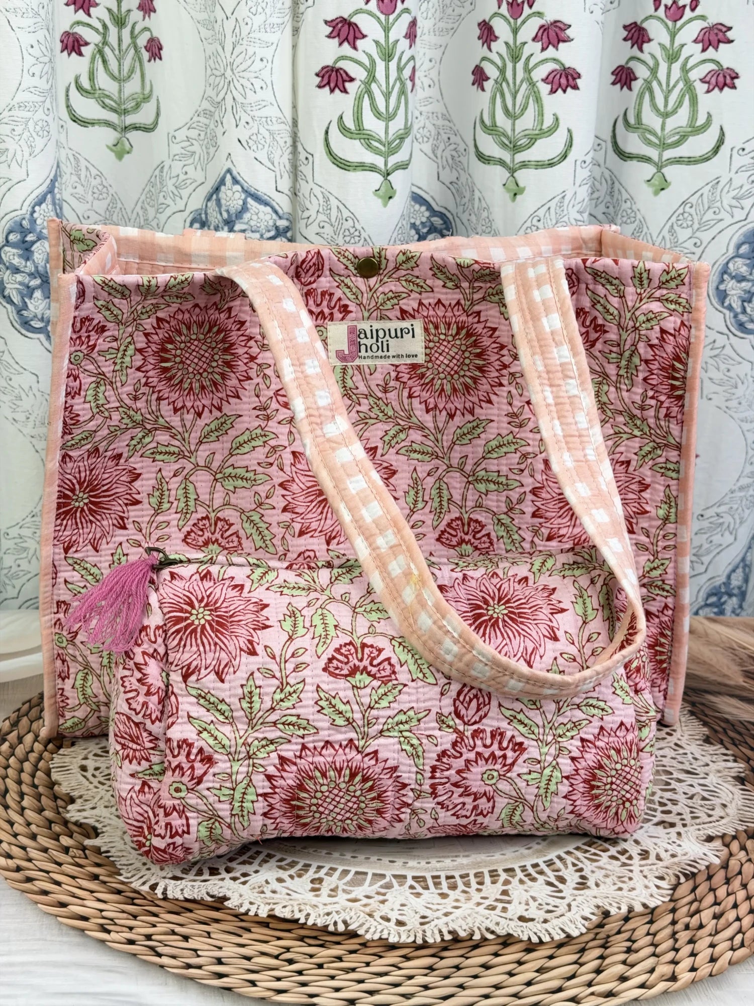 Jaipur block print cotton quilted button tote bag with matching pouch, peach and pink floral print, 15×12×6 inch tote with 10×6 inch pouch for organizing toiletries, cosmetics and small essentials side view