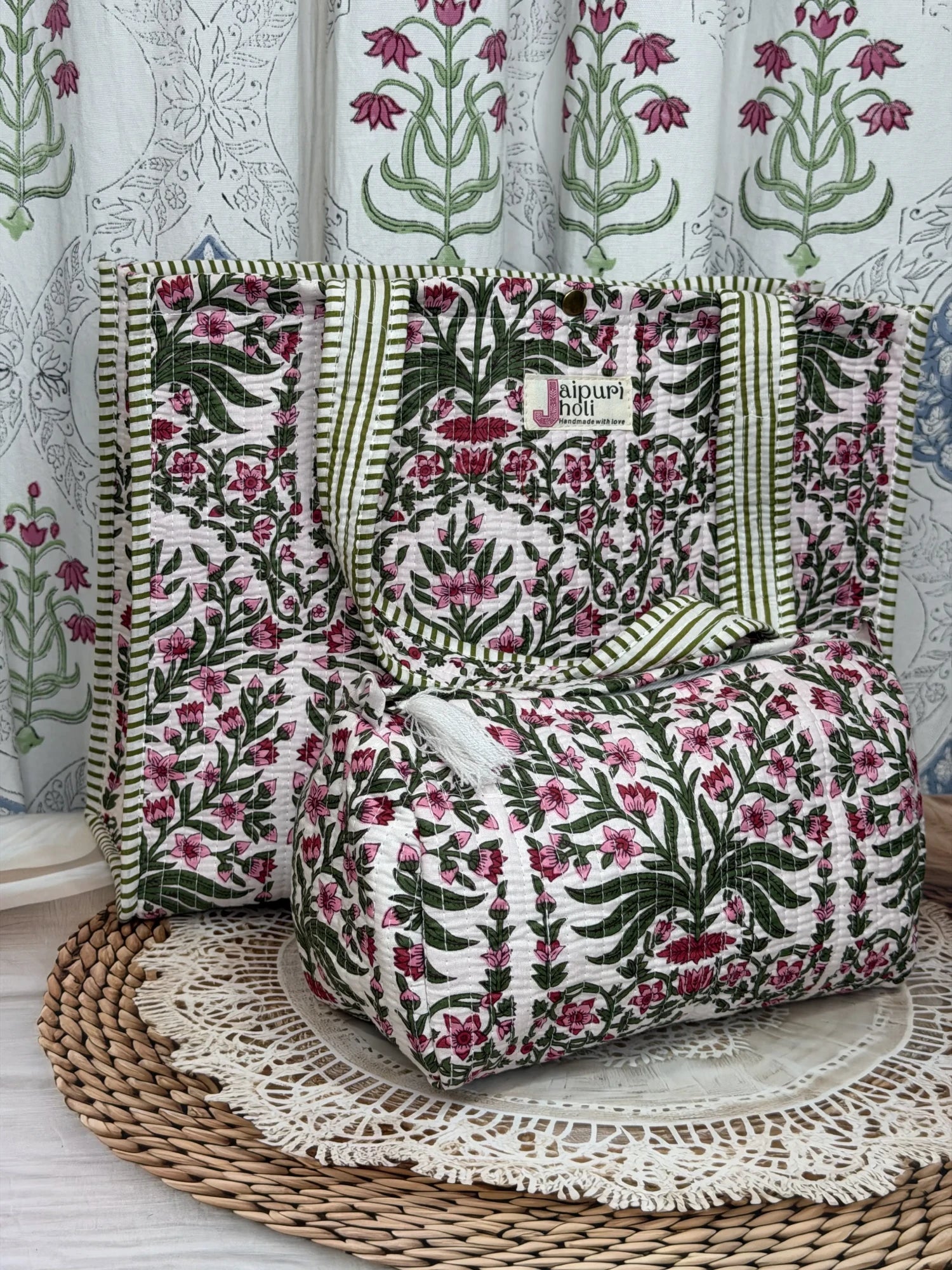 Jaipur block print cotton quilted button tote bag with matching pouch, pink floral and green leaf print, 15×12×6 inch tote with 10×6 inch pouch for organizing toiletries, cosmetics and travel essentials front view