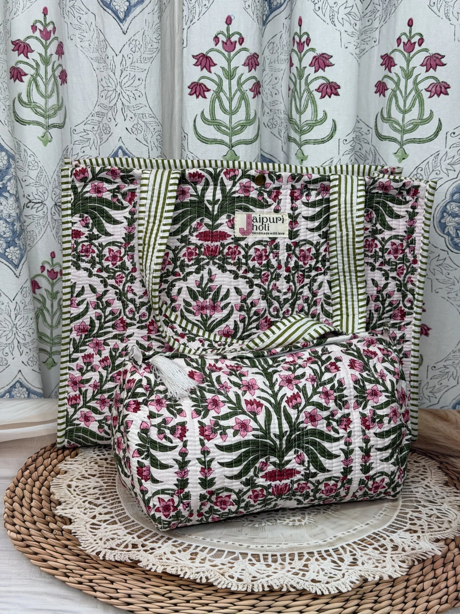 Jaipur block print cotton quilted button tote bag with matching pouch, pink floral and green leaf print, 15×12×6 inch tote with 10×6 inch pouch for organizing toiletries, cosmetics and travel essentials side view