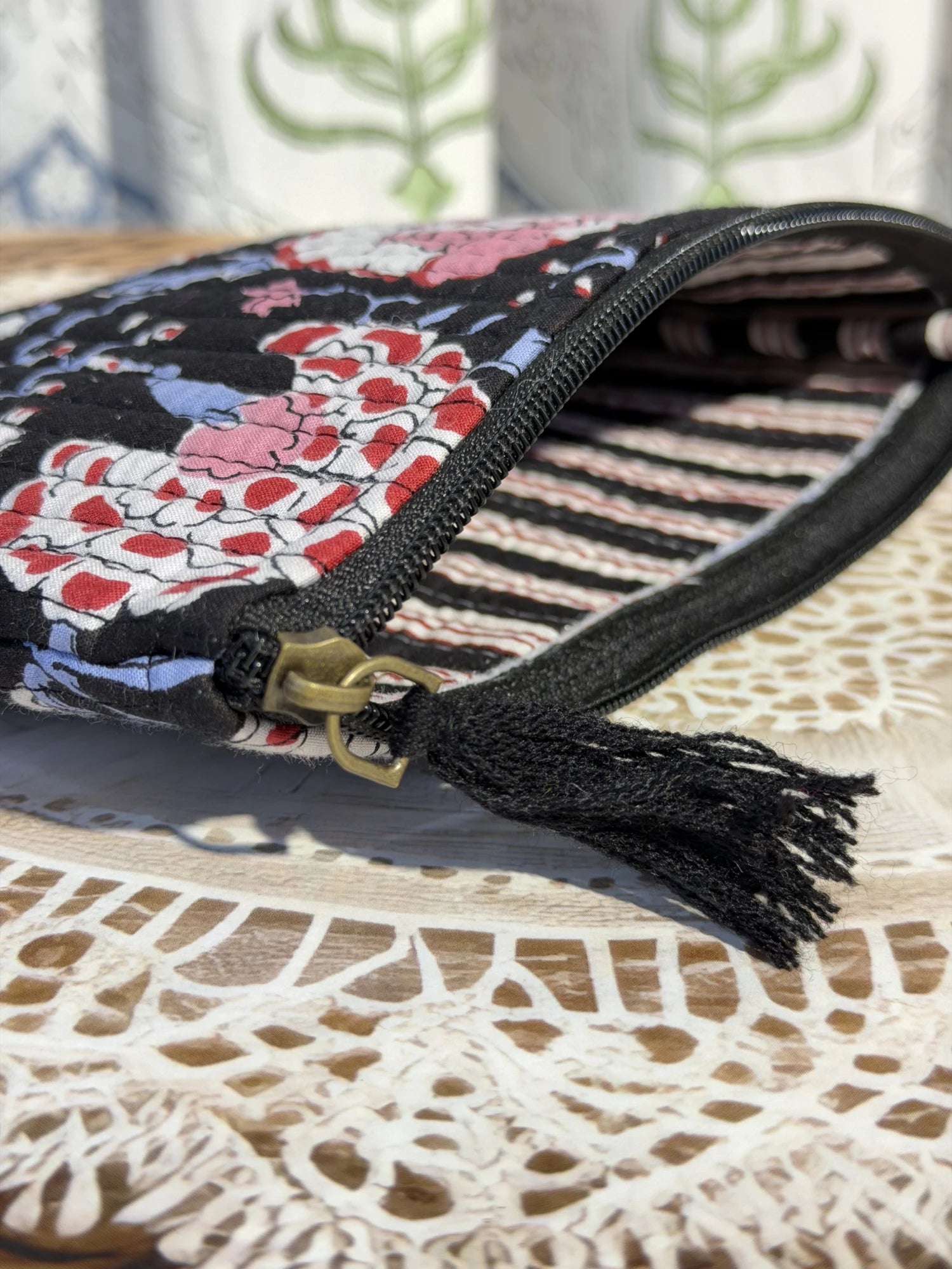 Jaipur Block Print Cotton Quilted Flat Pouch in black and pink floral print, medium 9 × 7 inch zip pouch for everyday use back view