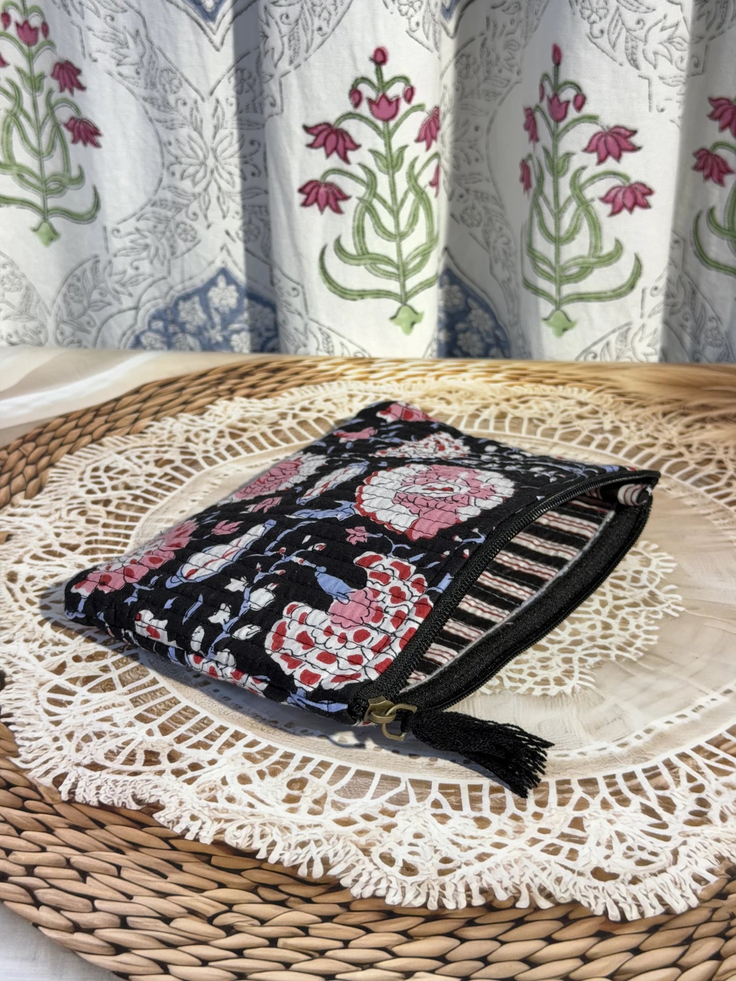 Jaipur Block Print Cotton Quilted Flat Pouch in black and pink floral print, medium 9 × 7 inch zip pouch for everyday useclose-up view