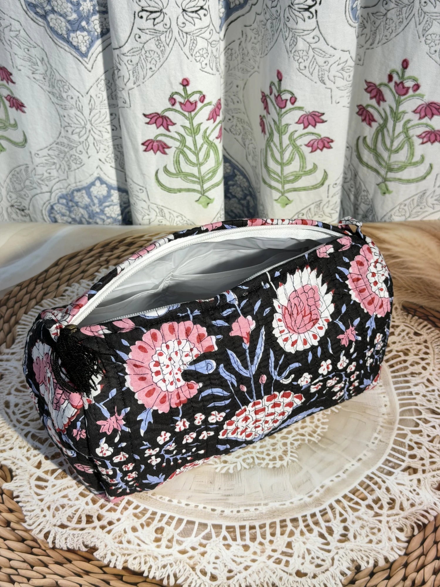 Jaipur Block Print Cotton Quilted Makeup Pouch in black and pink floral print, 10 × 6 inch zip pouch for cosmetics and beauty essentials front view