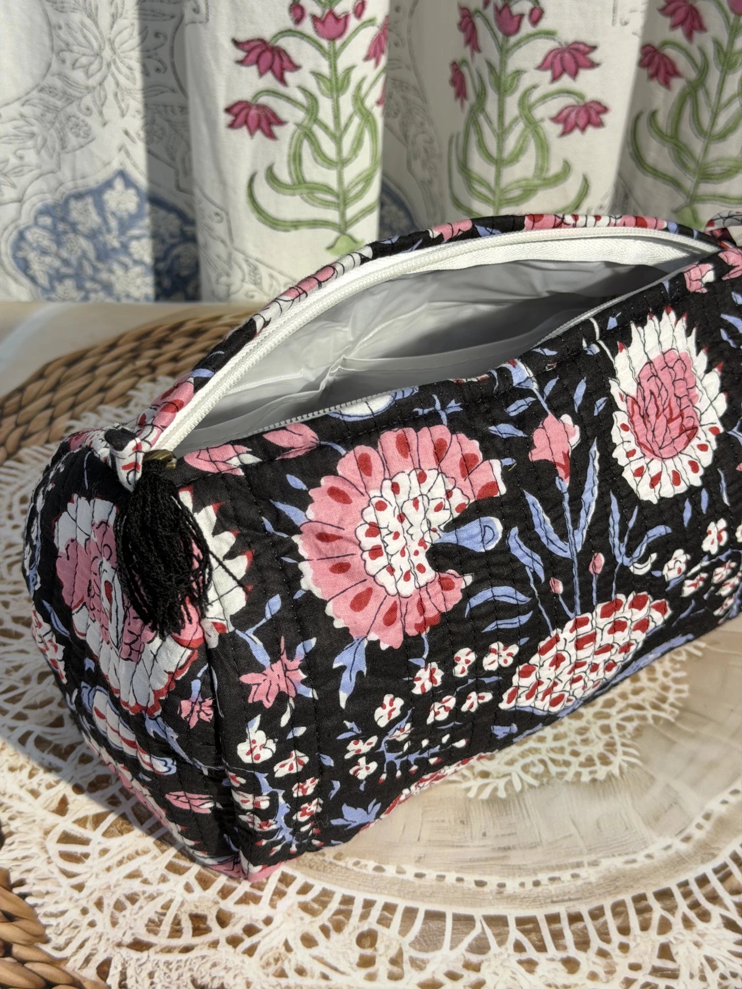 Jaipur Block Print Cotton Quilted Makeup Pouch in black and pink floral print, 10 × 6 inch zip pouch for cosmetics and beauty essentials side view