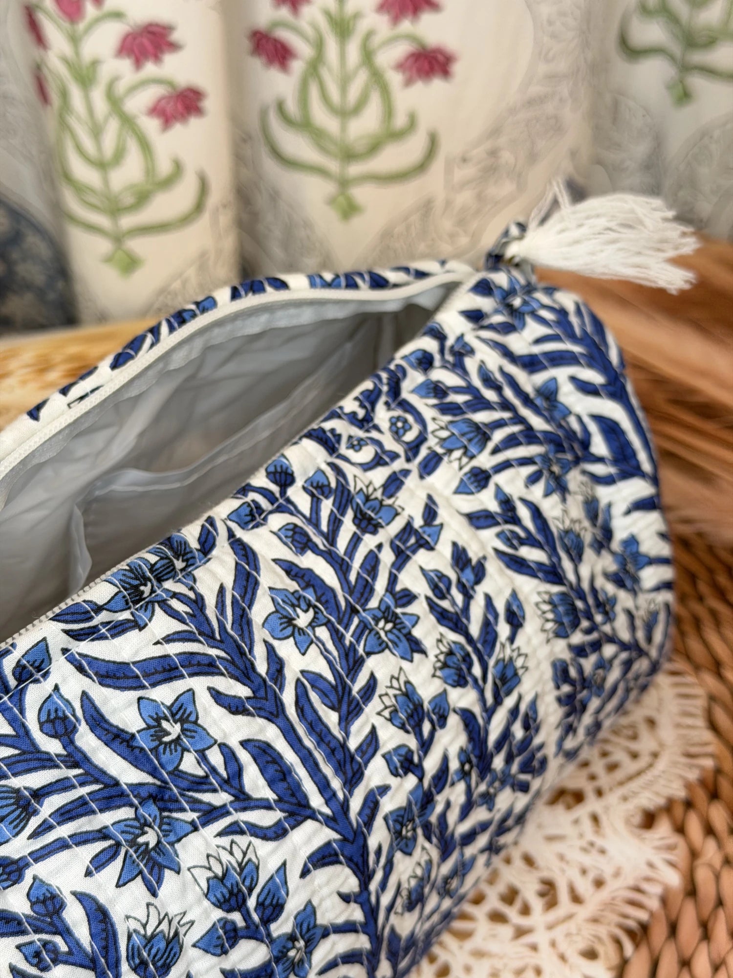 Jaipur Block Print Cotton Quilted Cosmetic Pouch in blue floral leaf print, 10 × 6 inch zip pouch for makeup and skincare essentials close-up view