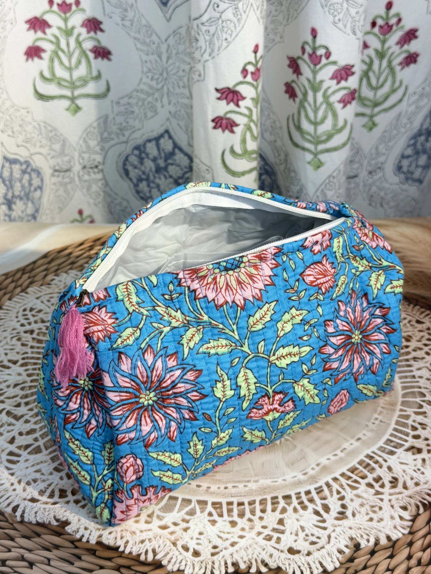 Jaipur Block Print Cotton Quilted Toiletry Pouch in blue floral print, 10 × 6 inch zip pouch for travel and daily use front view